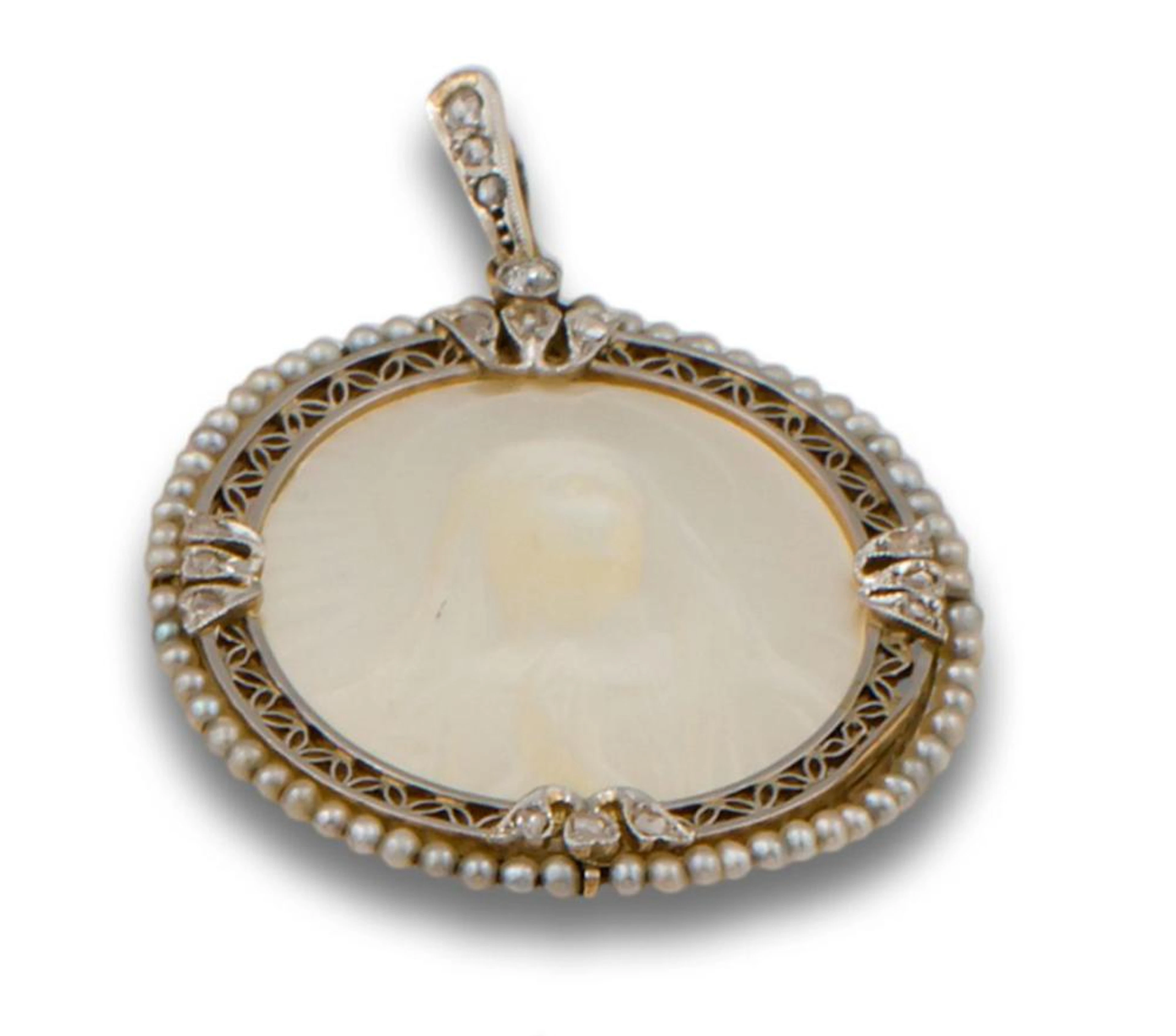 A VINTAGE MOTHER-OF-PEARL AND DIAMOND MEDALLION PENDANT