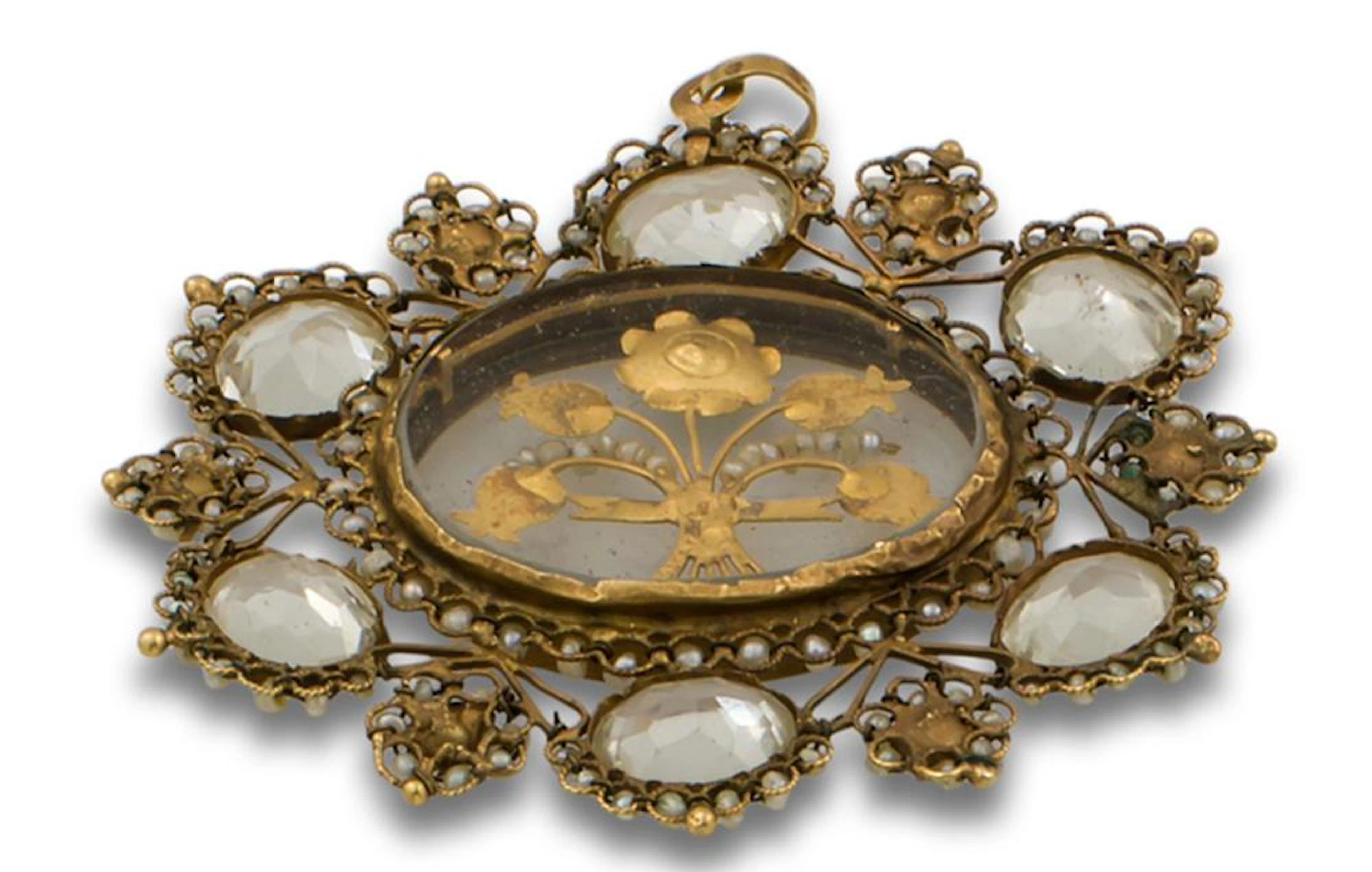 AN ANTIQUE GILT METAL, PEARL AND QUARTZ PENDANT