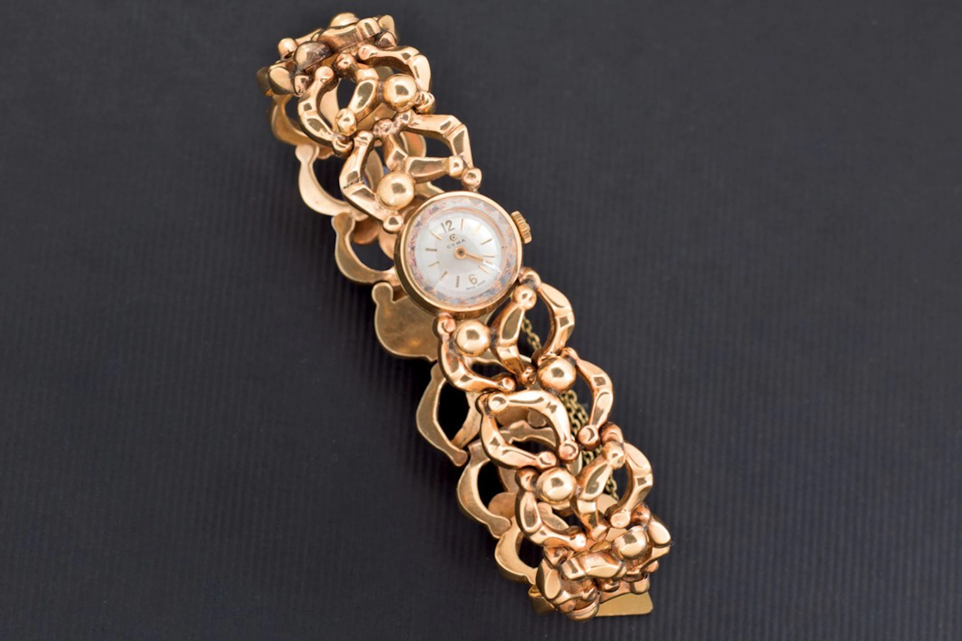 Reloj Cyma de oro