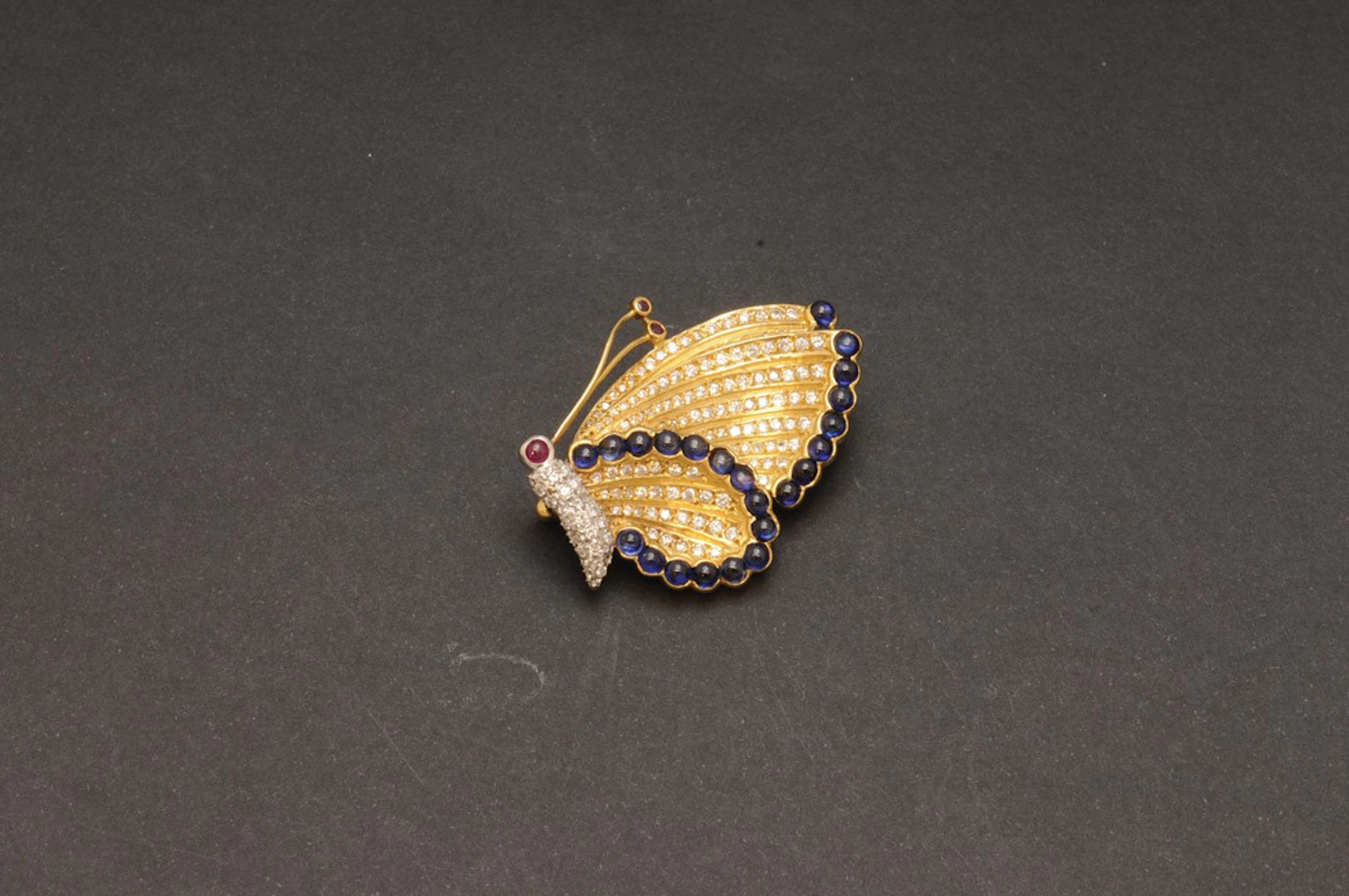 Broche mariposa de oro zafiros, rubí y diamantes