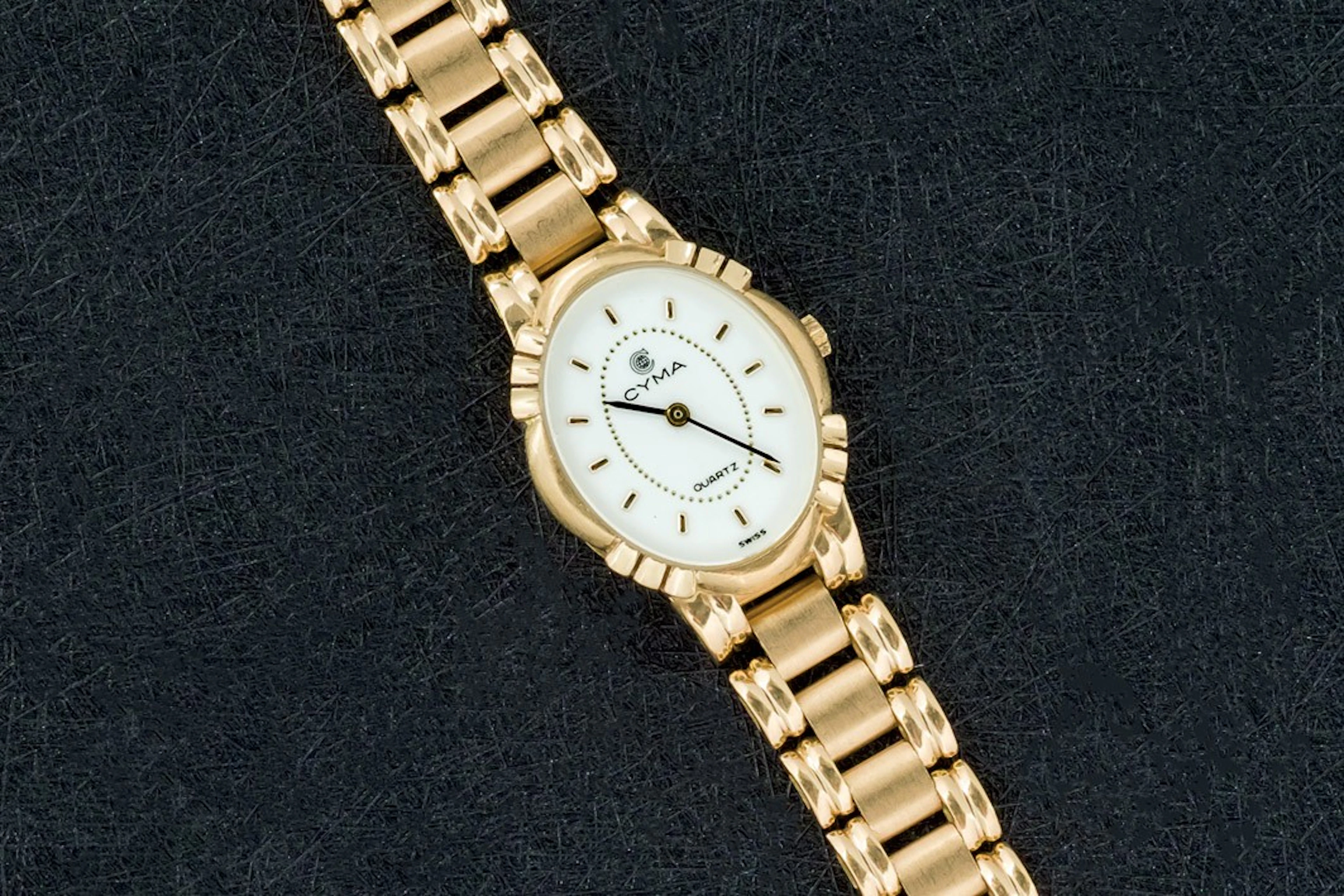 Reloj Cyma de oro