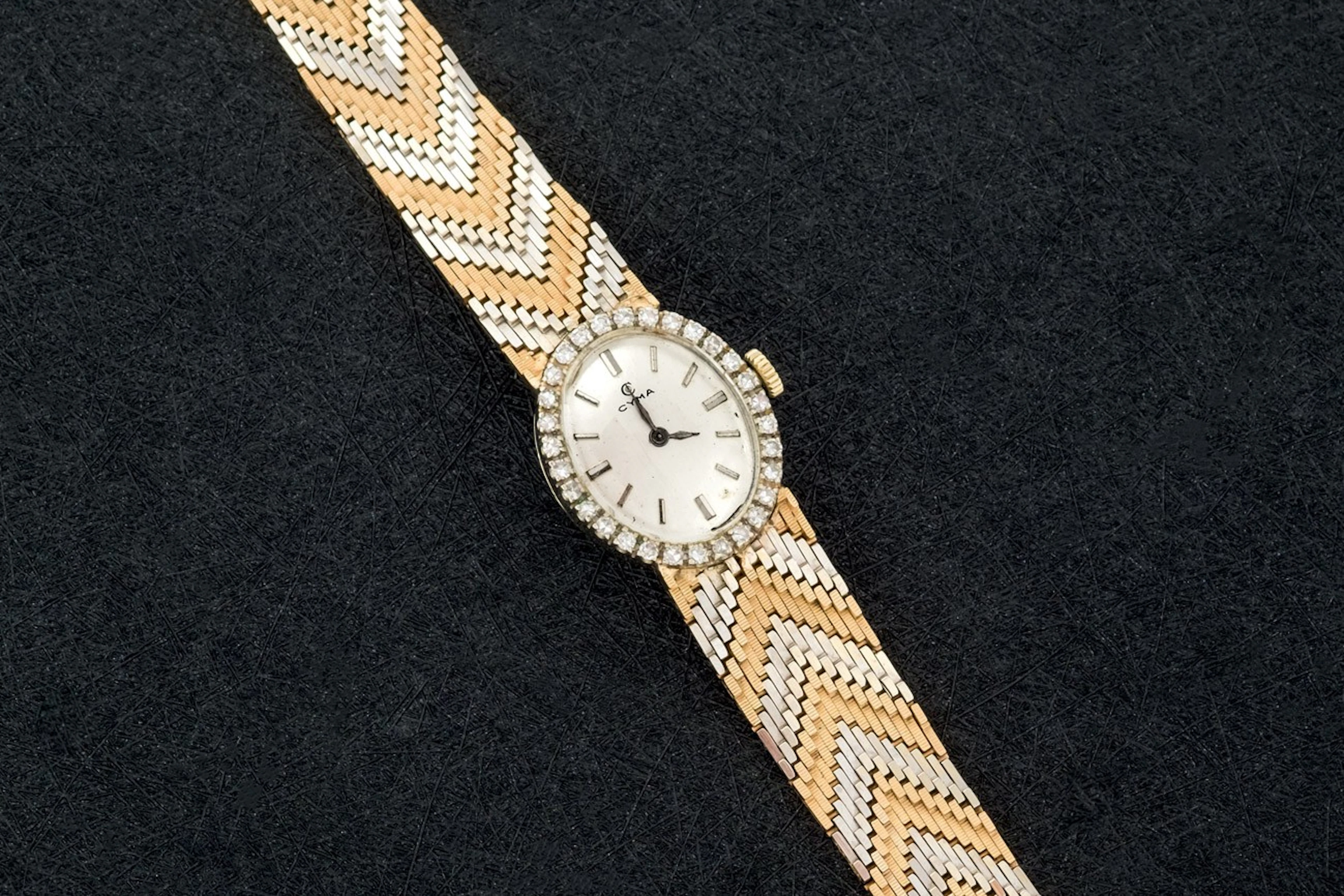 Reloj Cyma de oro bicolor y diamantes
