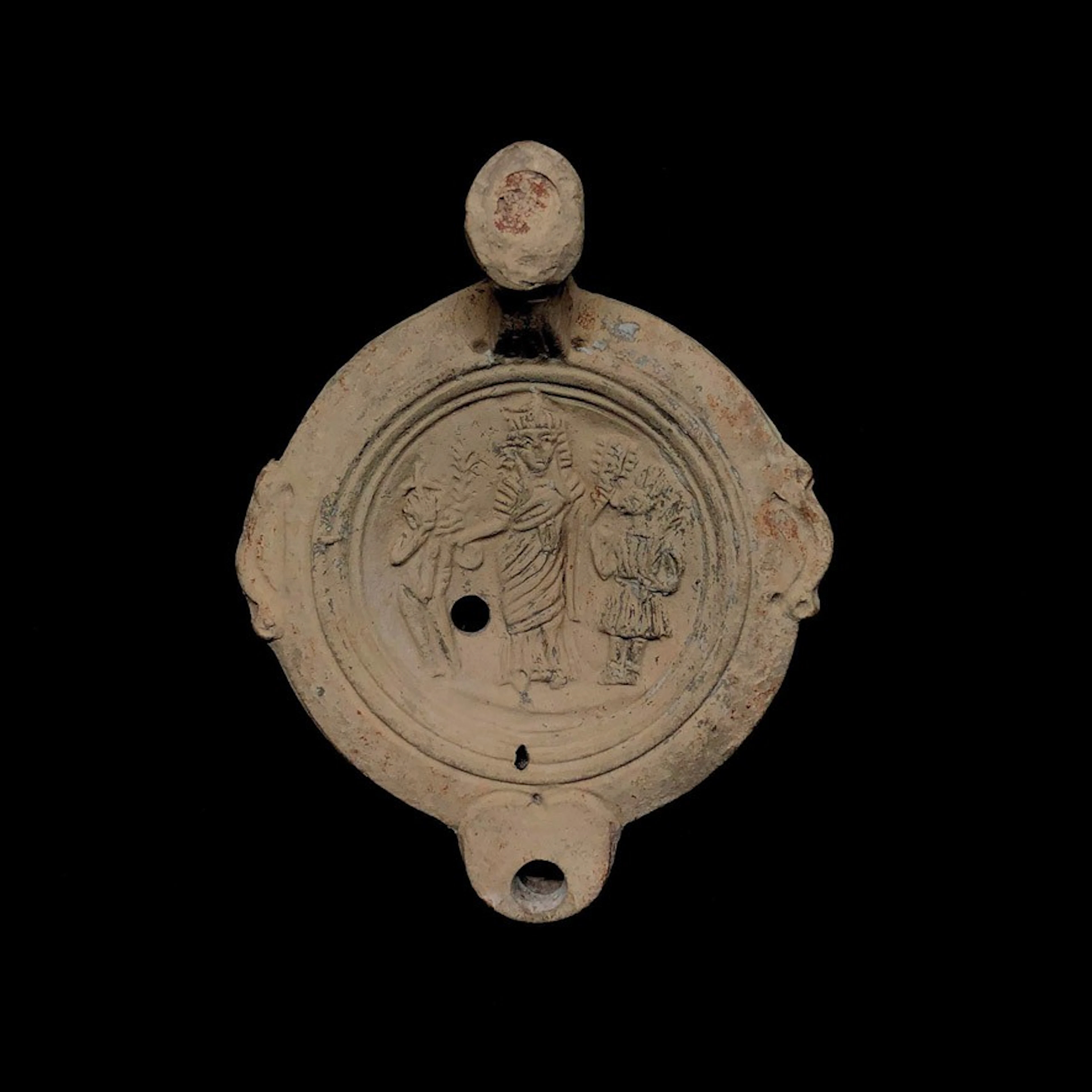 Lucerna romana de terracota con Harpócrates