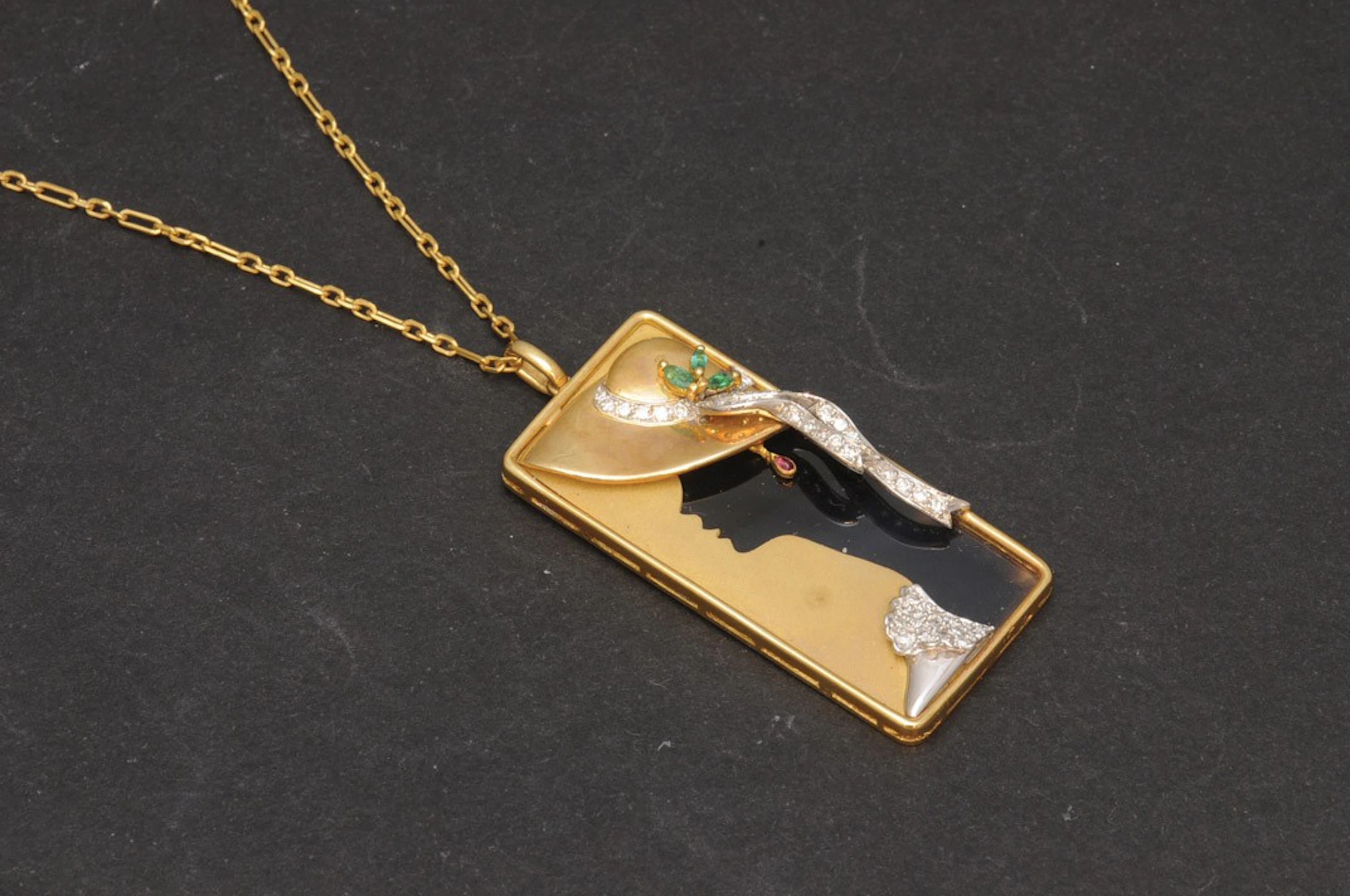 Colgante de oro con diamantes y esmeraldas