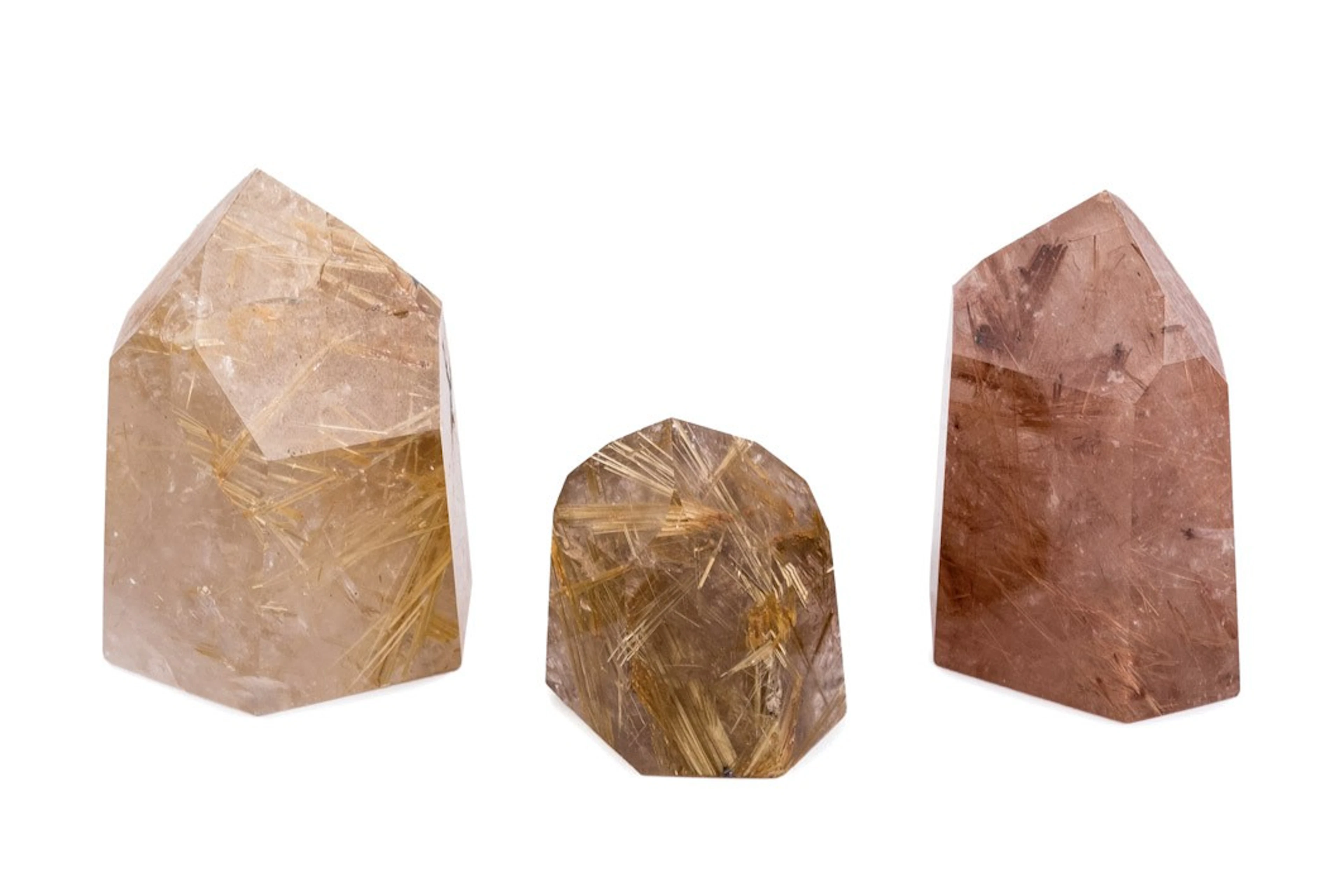 Tres prismas de cuarzo rutilado