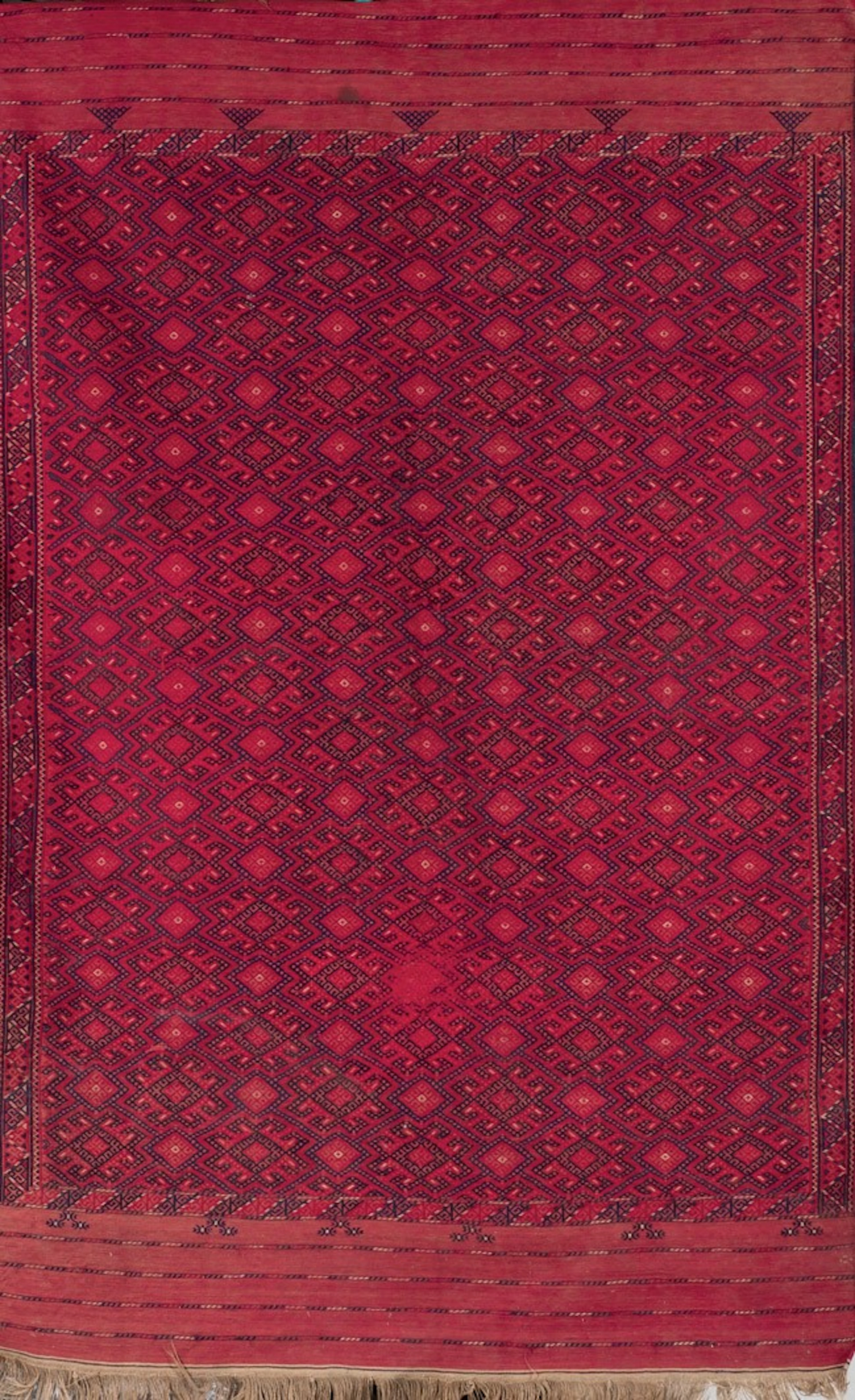 Alfombra Bukhara S. XX. Tonos rojos