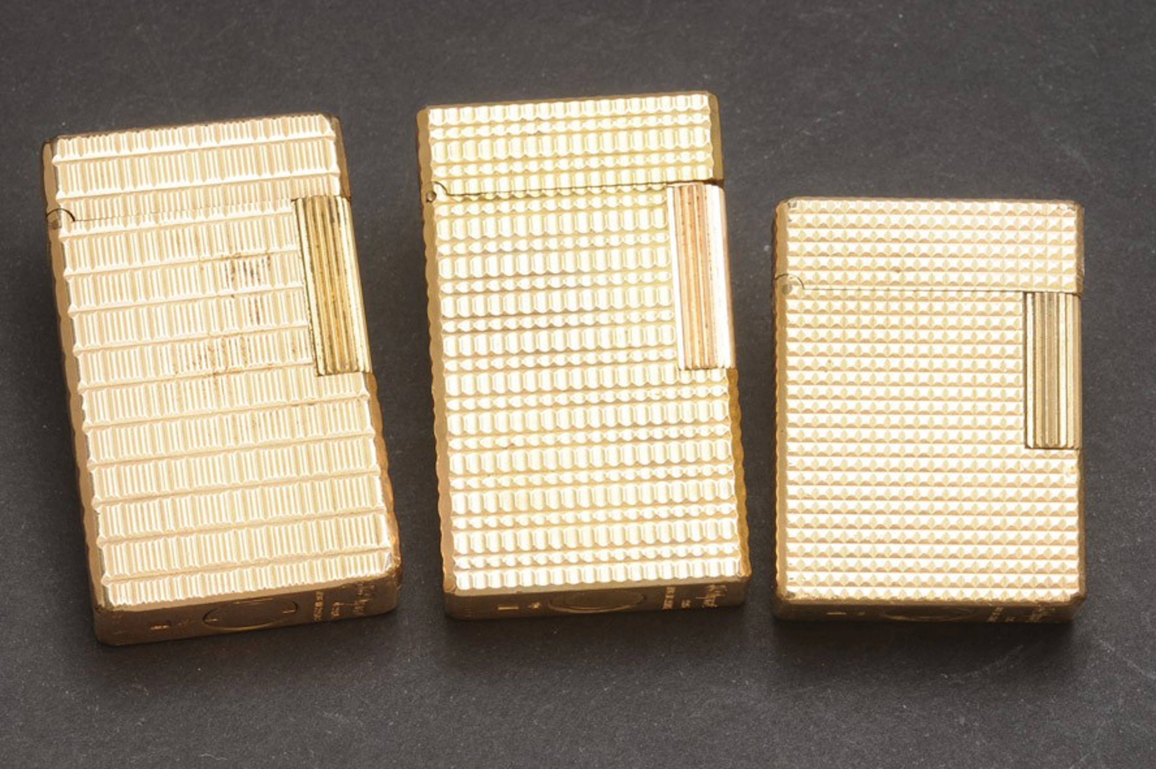 Tres encendedores S.T.Dupont