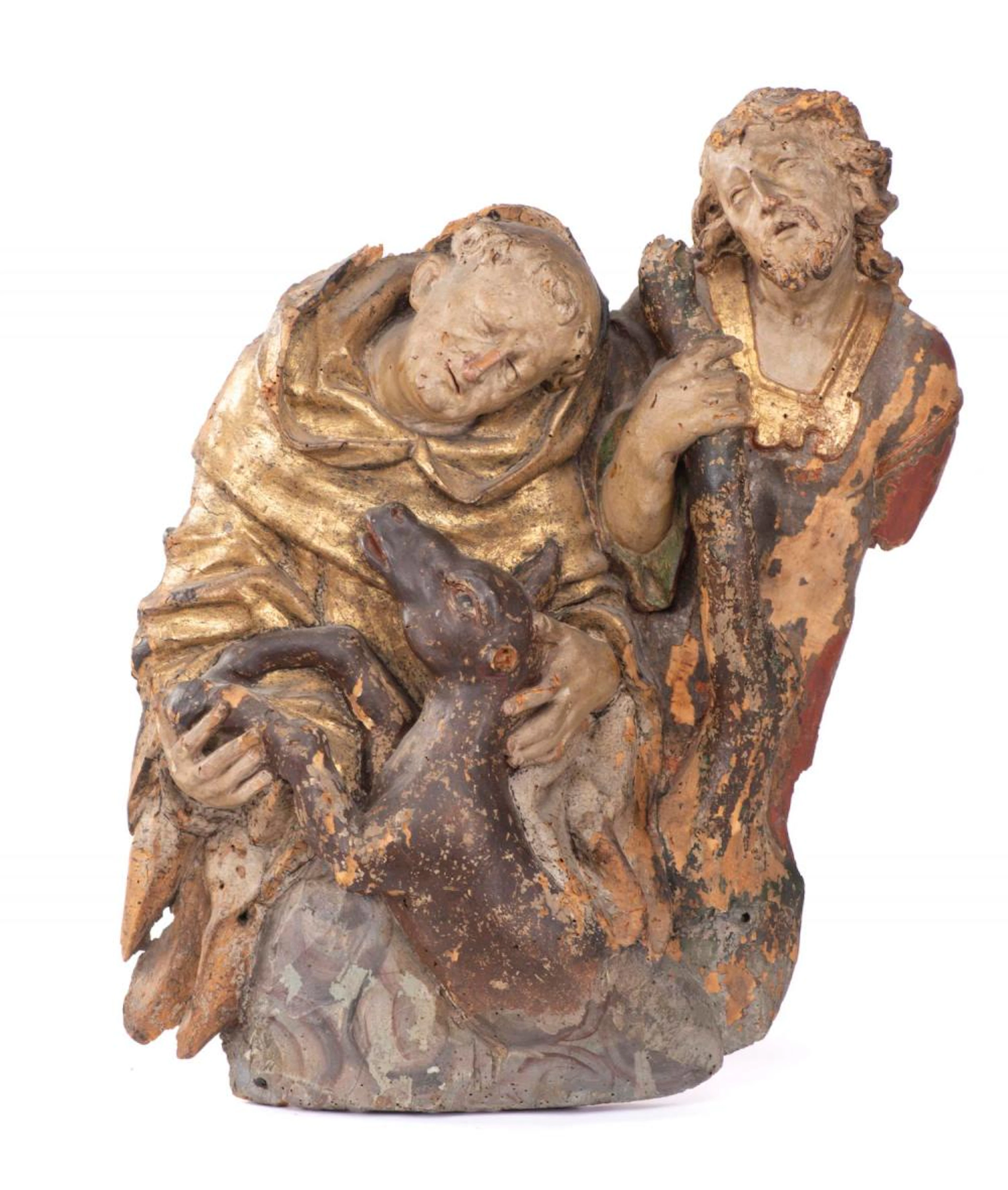 Sculpture en bois peint et doré représentant une scène religieuse.