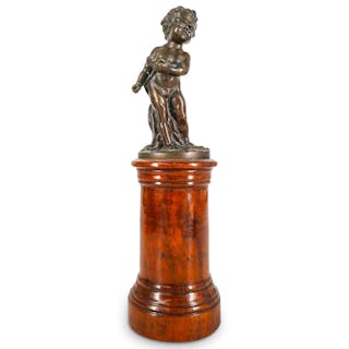 Bronze Sculpture Of A Young Boy On A Wooden Column Pedestal