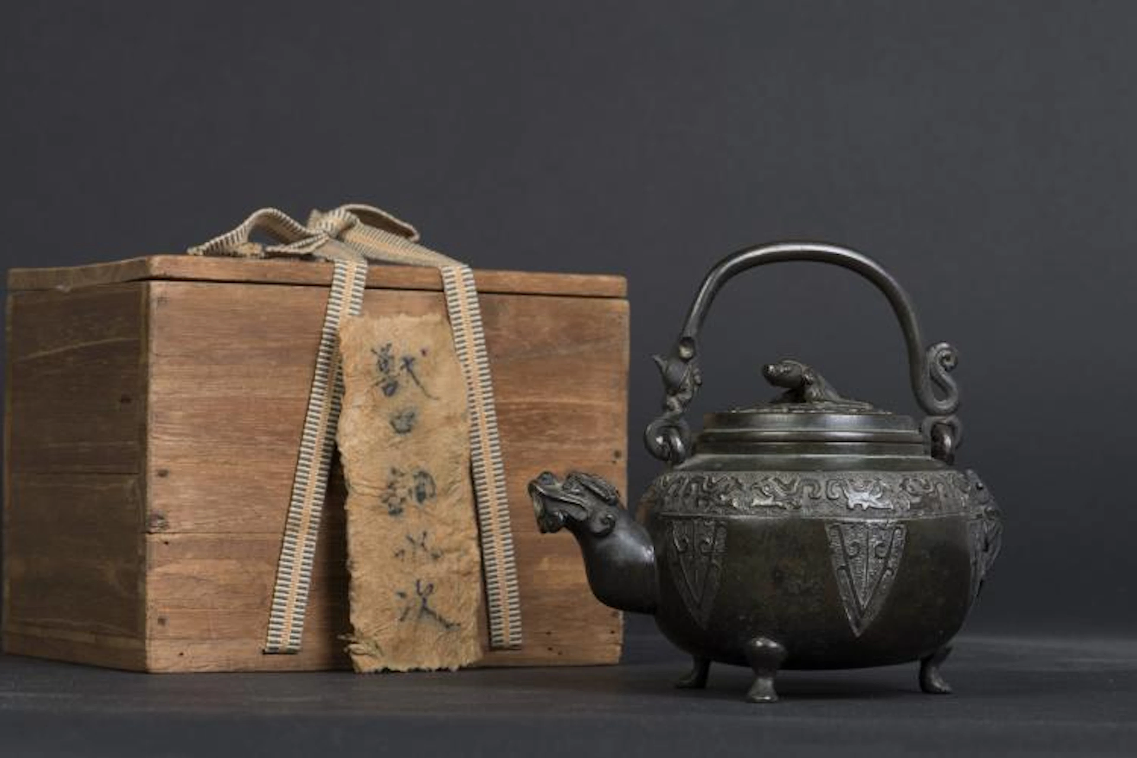A BRONZE TEAPOT
