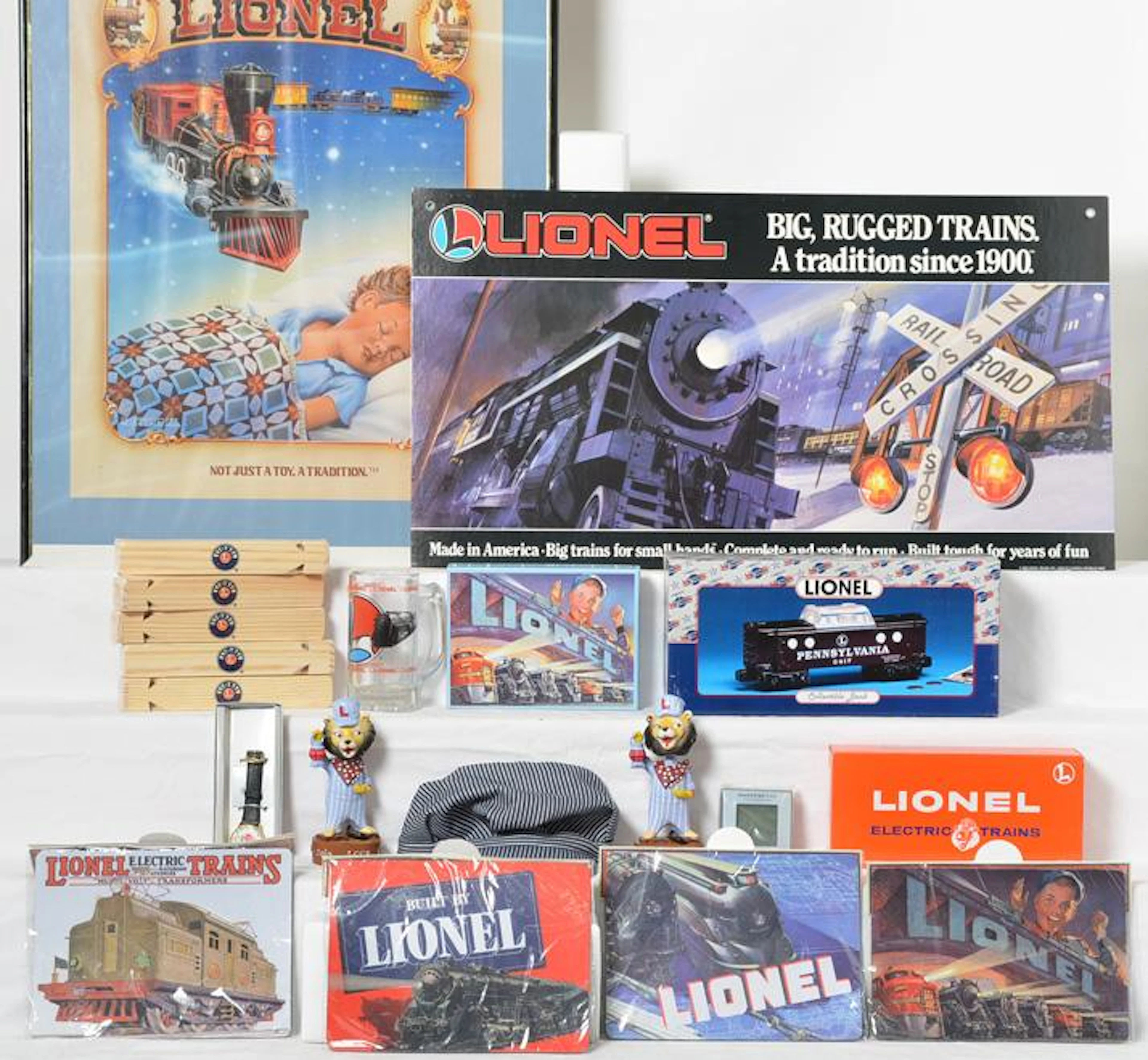 Lionel odds and ends. LTI dealer sign, LCCA Lenny bobble heads, Pennsylvania piggy bank