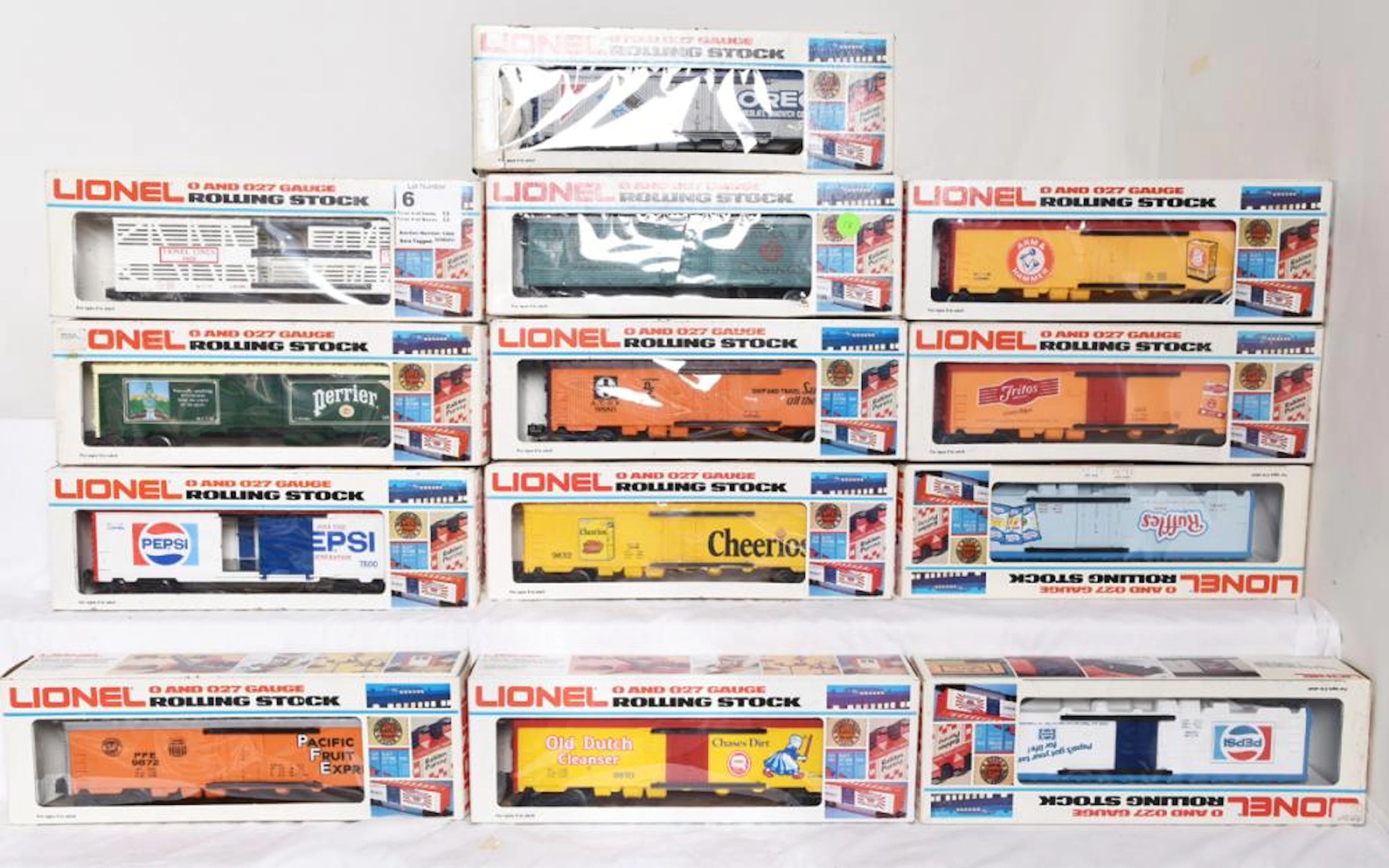 Thirteen Lionel Rolling Stock Cars. Pepsi, Santa Fe, Perrier, Reefer, Cattle Car, Box Car, 5700, 9884 etc