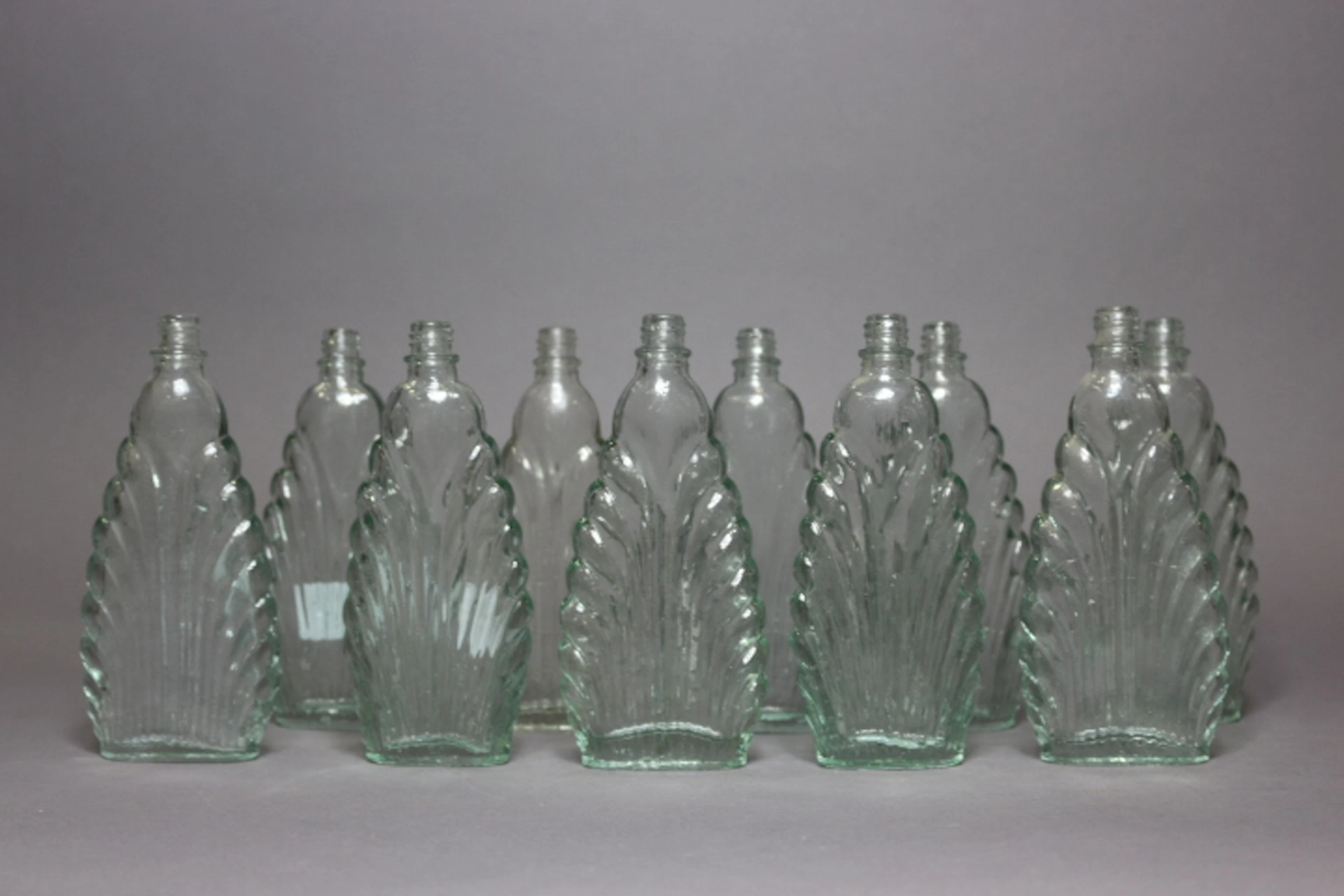 Lot of ten vintage Art Deco style perfume bottles, each appr