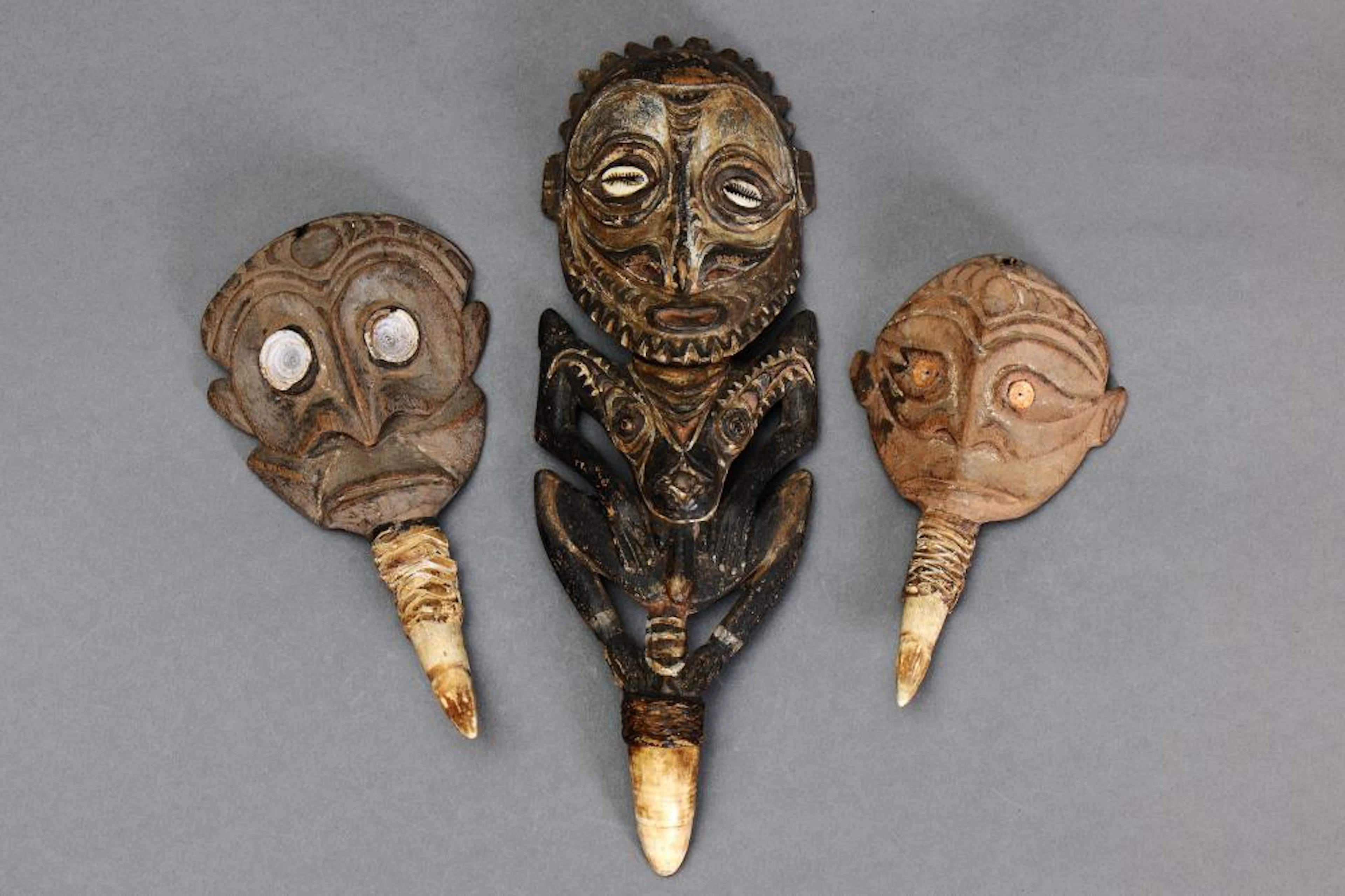 THREE SEPIK CROCODILE TOOTH PENDANTS, PAPUA NEW GUINEA.