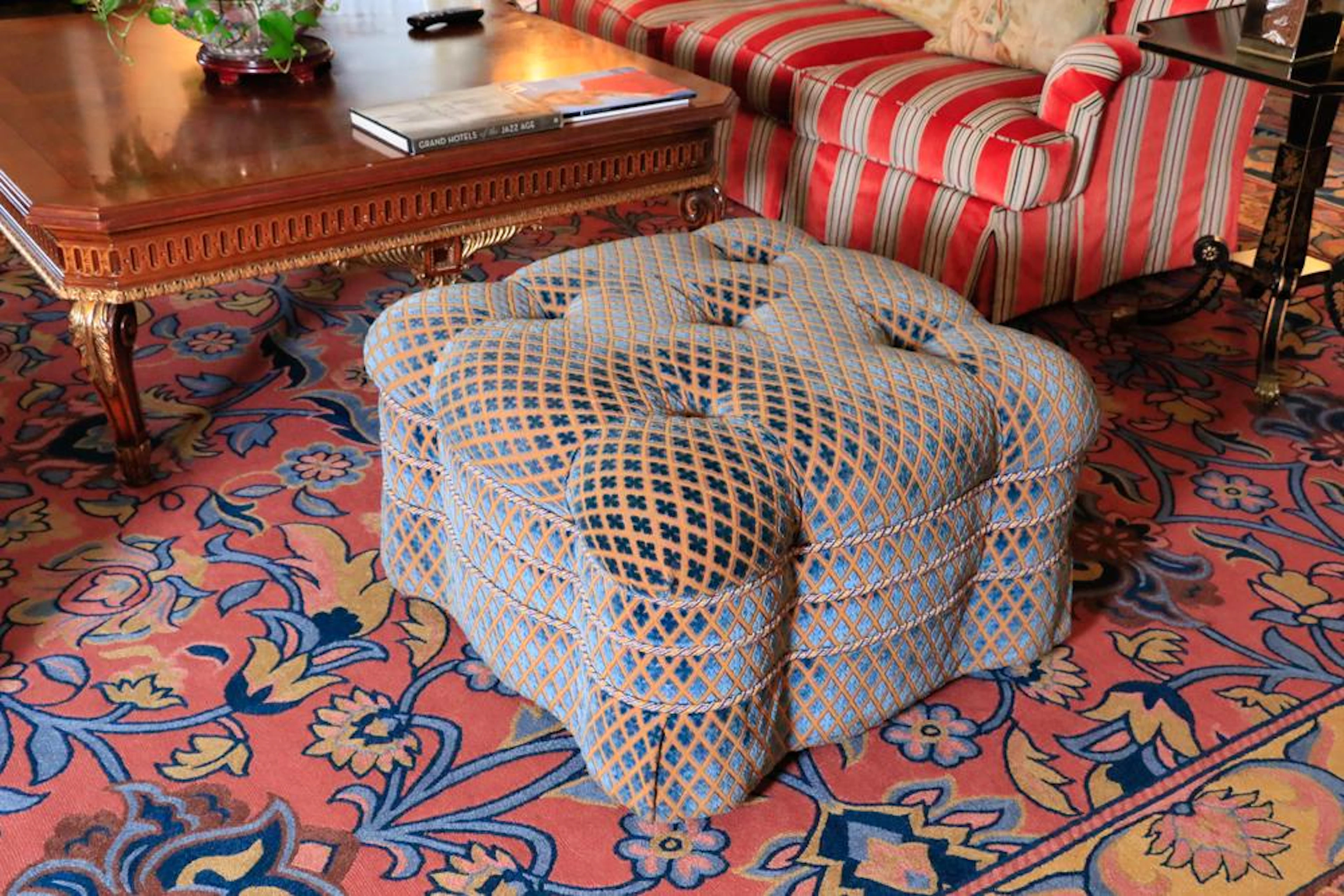 Victorian style tufted blue ottoman labeled Charter