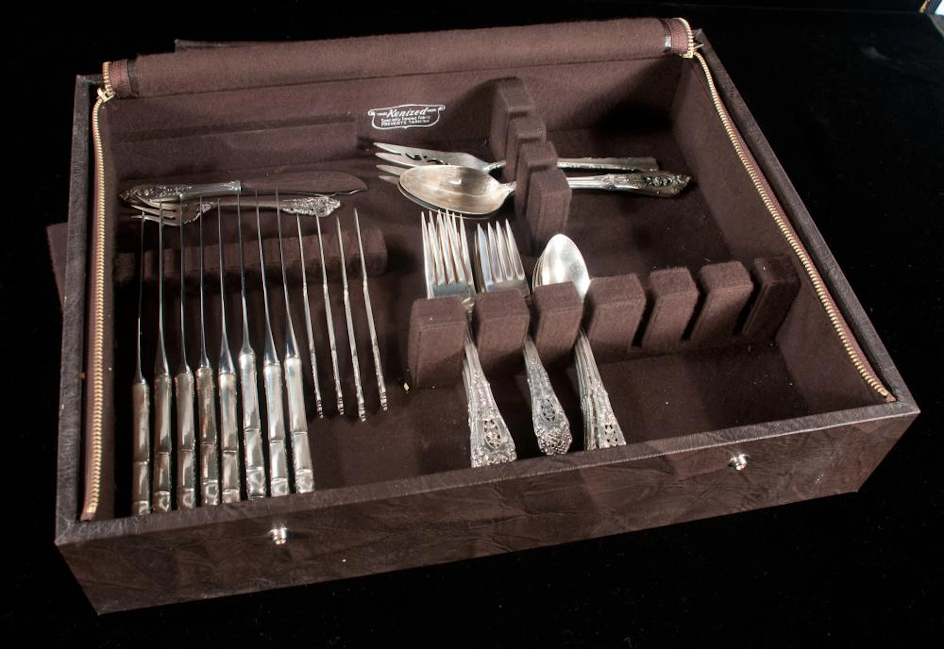 Set of 41 pieces of Wallace "RosePoint" sterling silver flatware in a leather box along with an odd sterling silver serving fork