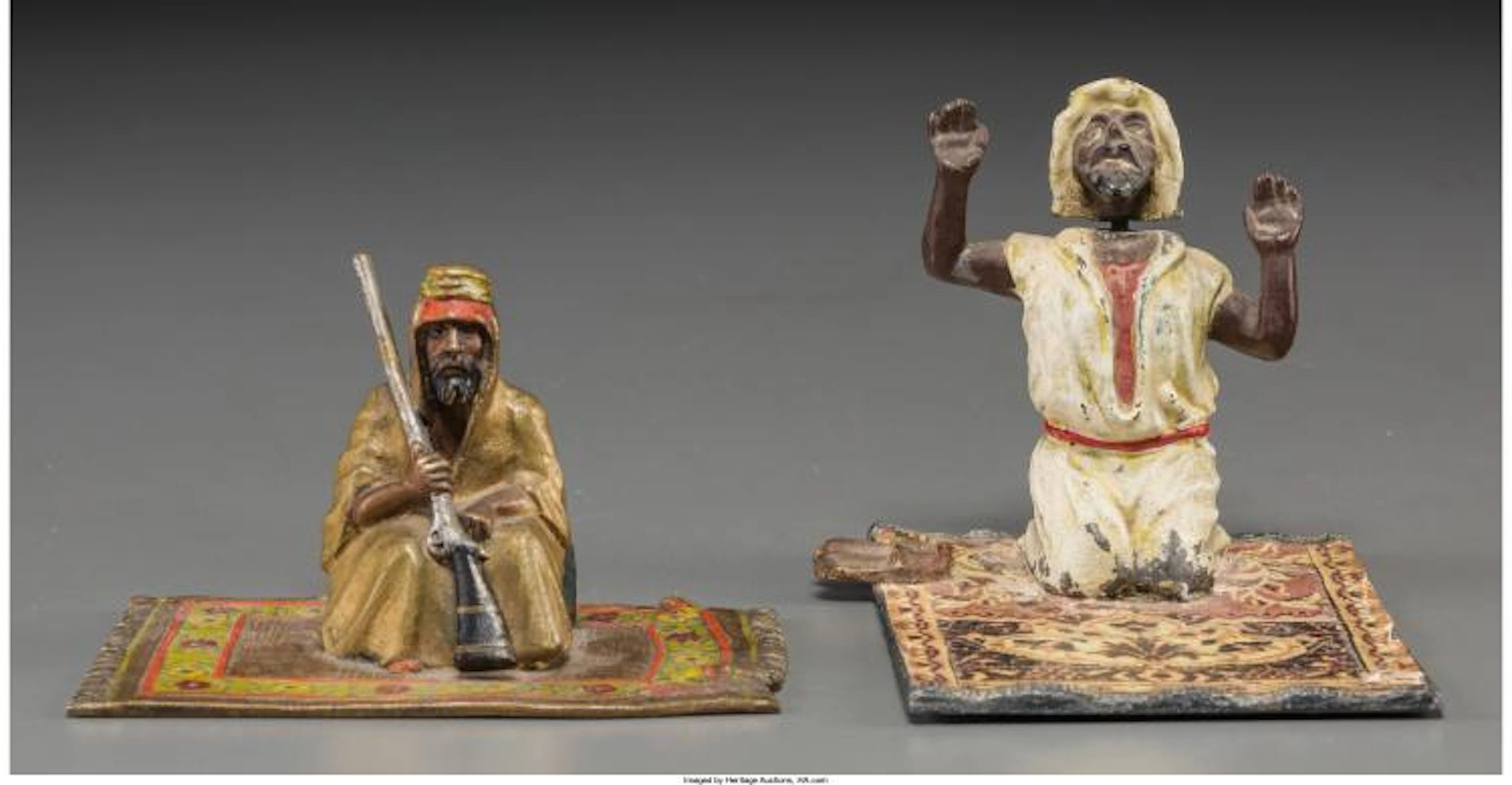 AN AUSTRIAN COLD-PAINTED BRONZE FIGURE OF A SEATED ARAB WITH ASSOCIATED BRONZED