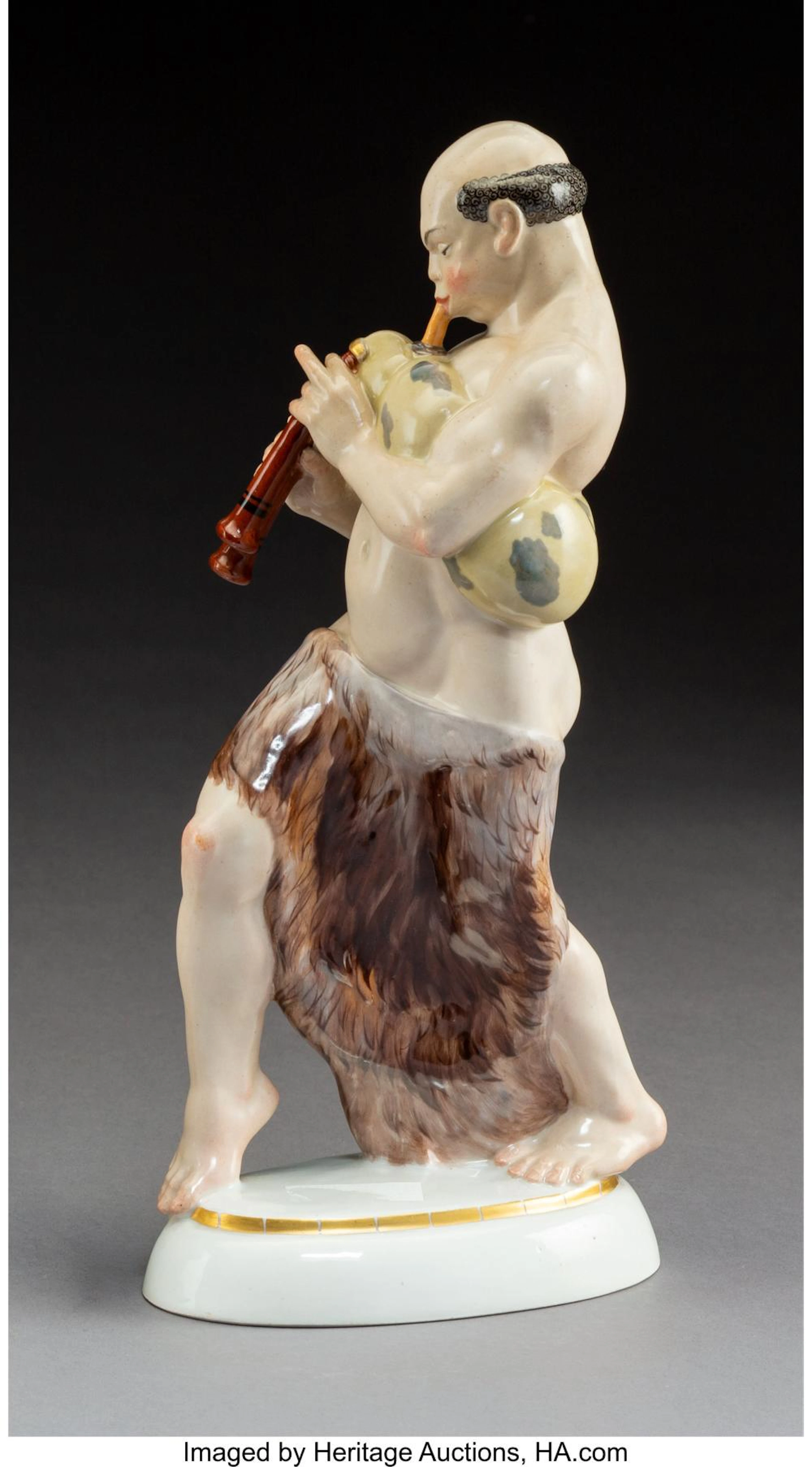 A KPM Polychromed Porcelain Arab with Bagpipe Figure Modeled by Adolph Amberg, B