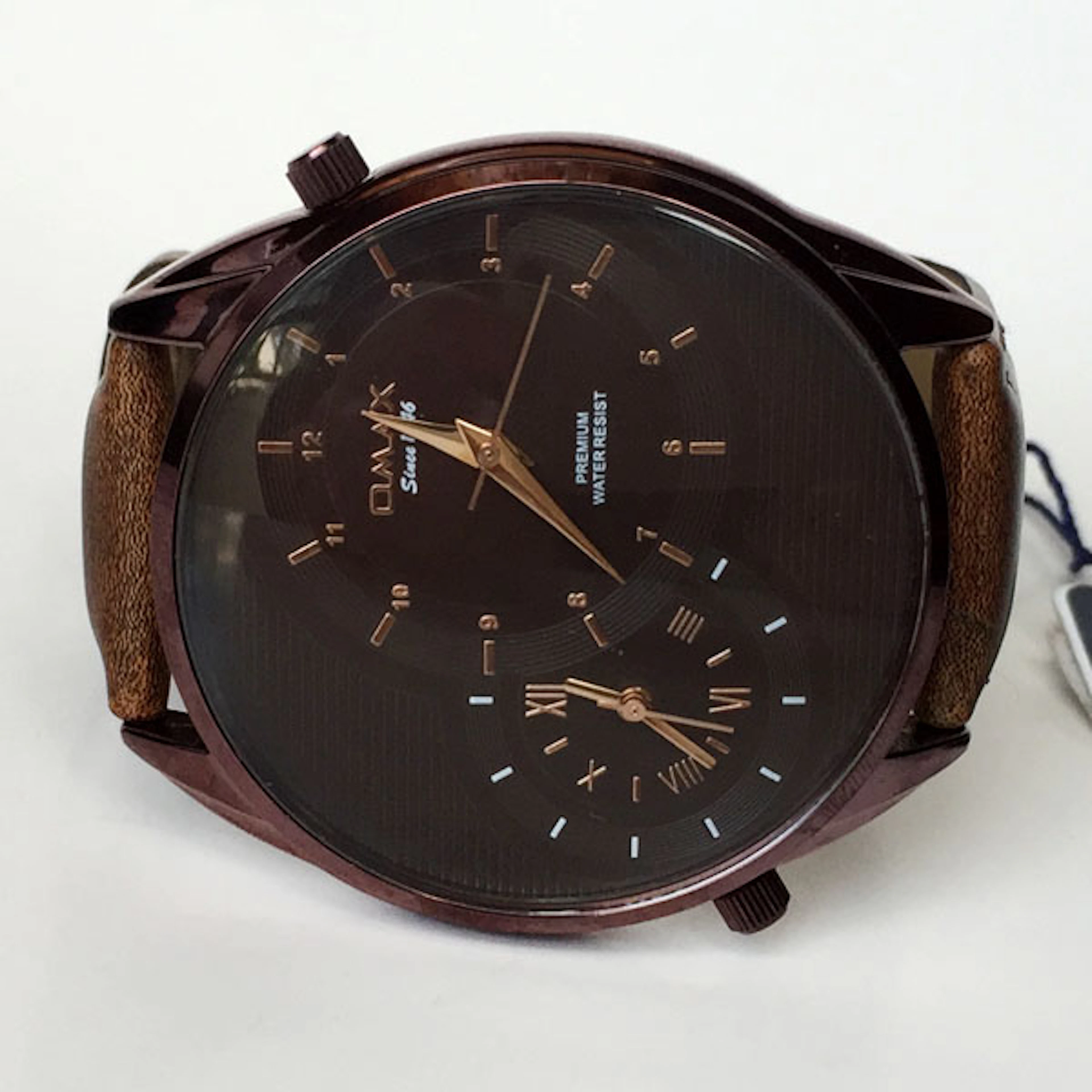 Brown color round watch OMAX since 1946 Premium water...