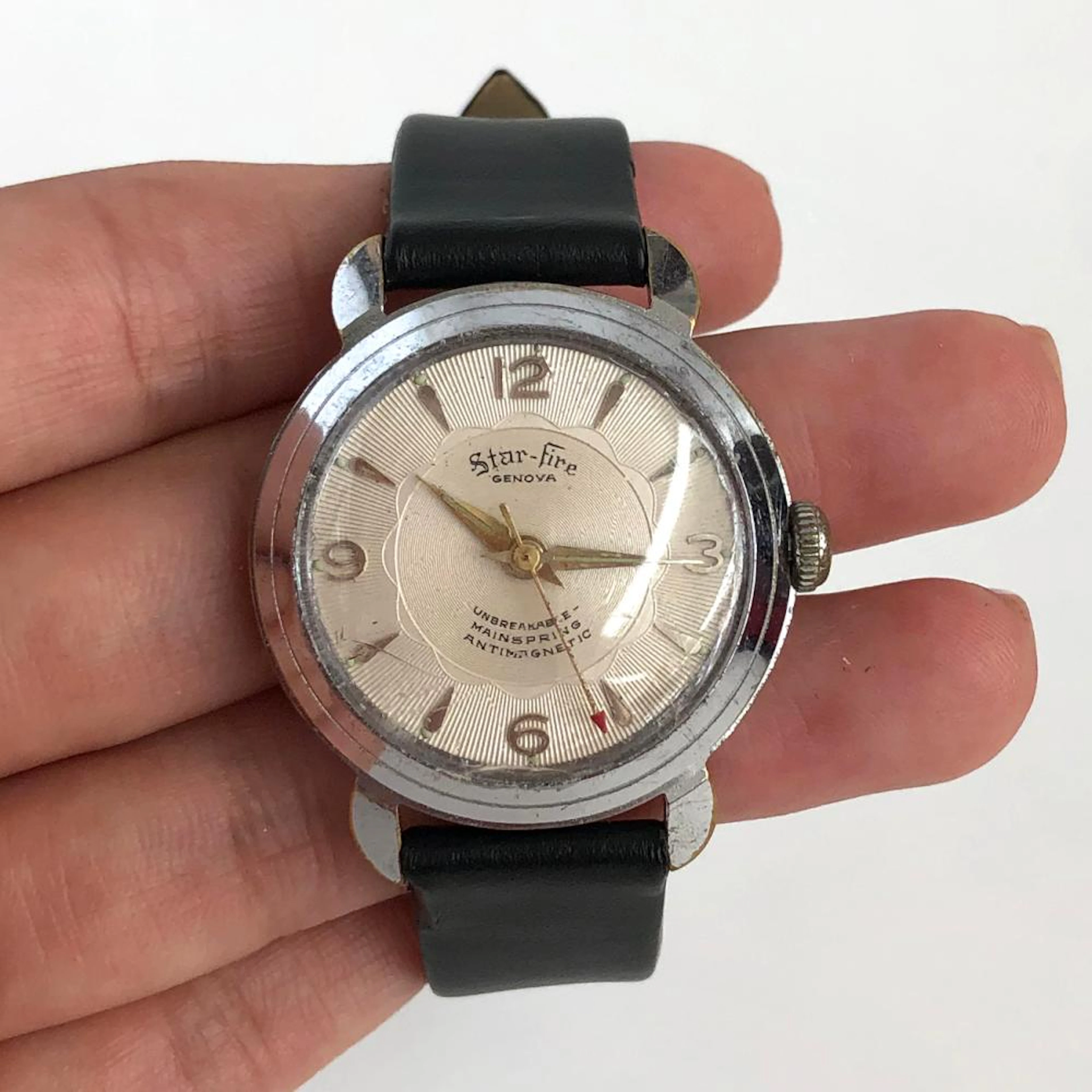 Vintage silver tone round men's Star-Fire Genova...
