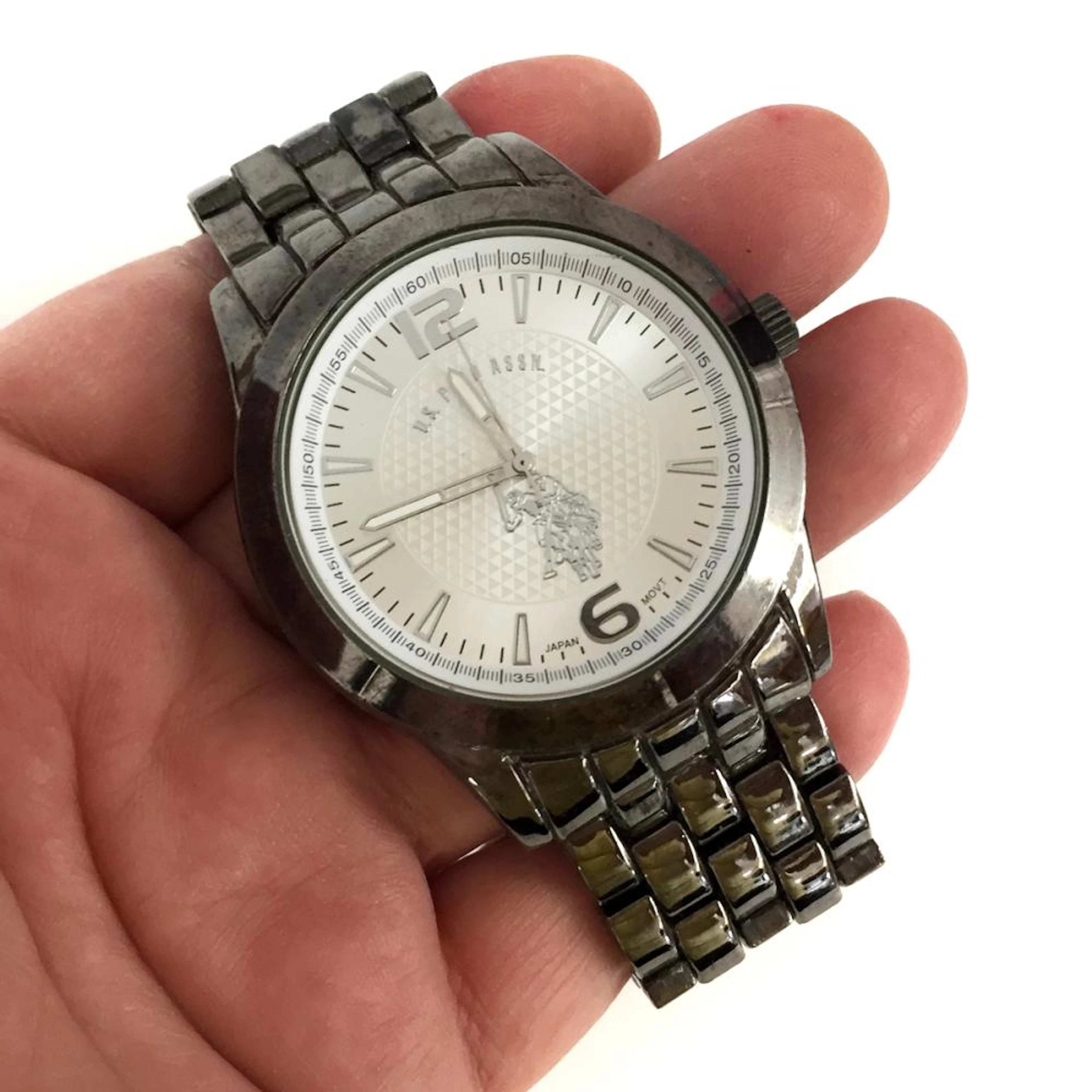 Darkened metal round men's U.S