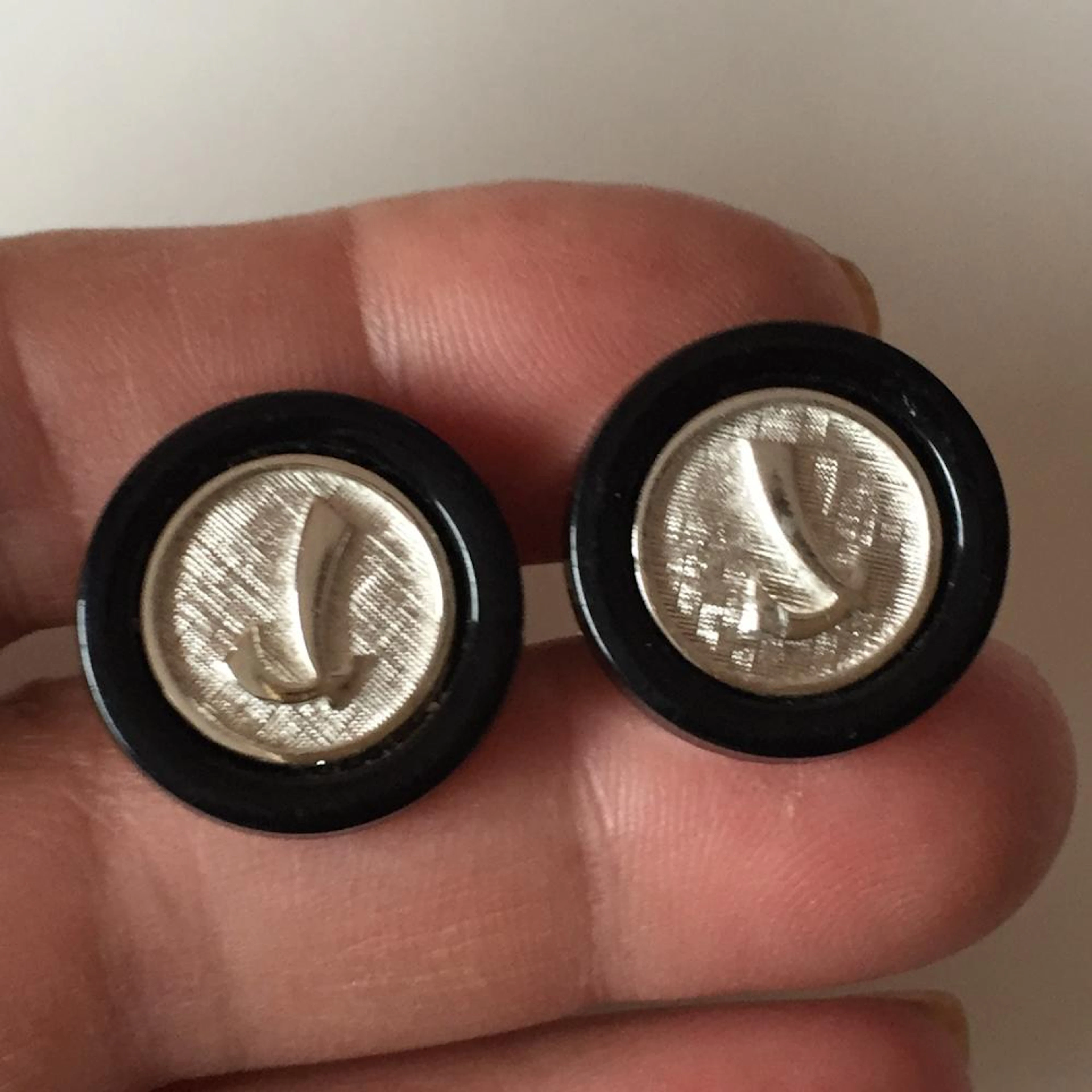 SWANK: Silver tone textured finish round cufflinks with...