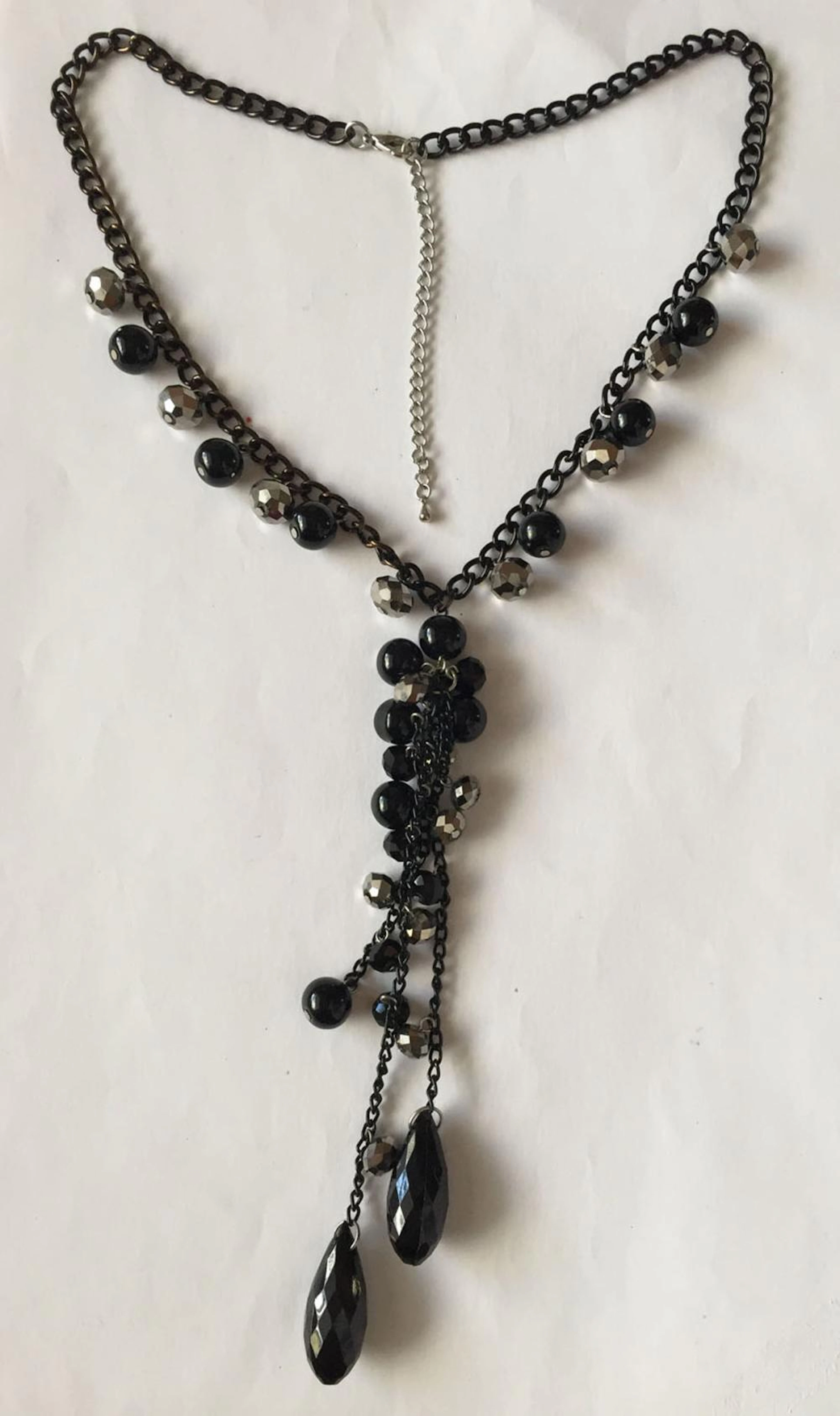 Blackened chain with dangling round faceted and plain beads