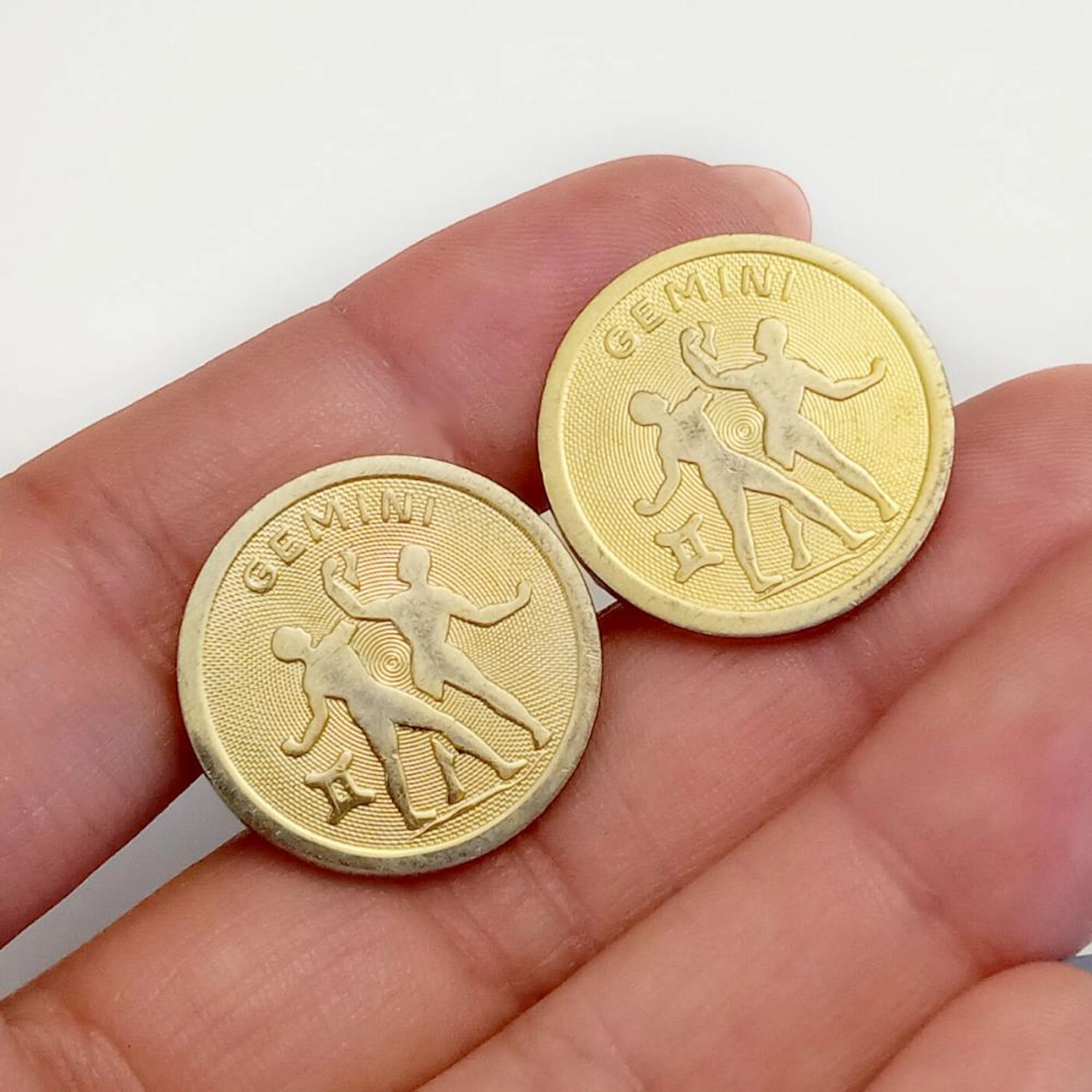 DANTE: Gold tone textured finish GEMENI round shape cufflinks, signed