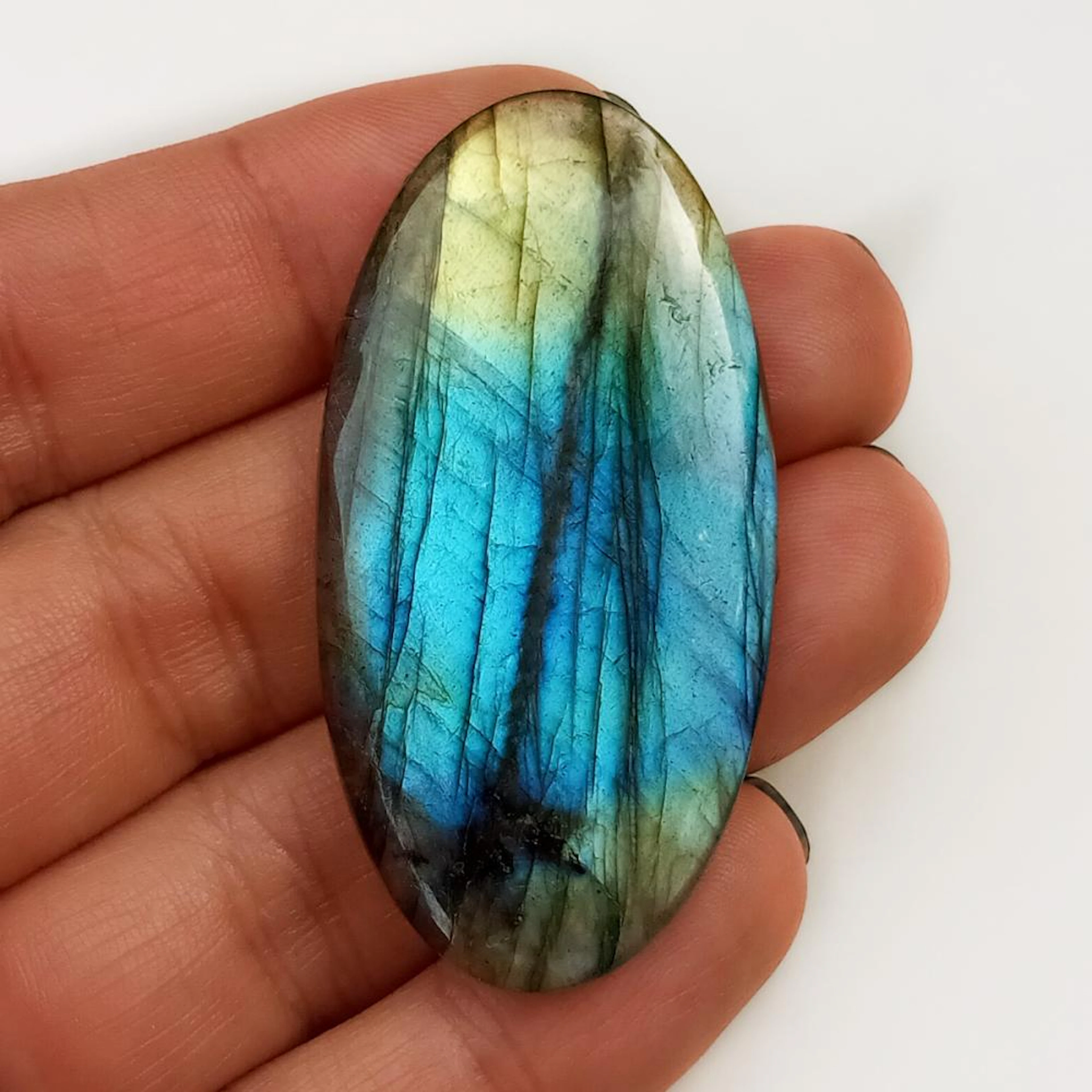 Oval shape labradorite flat cabochon, weight 48.32 cts
