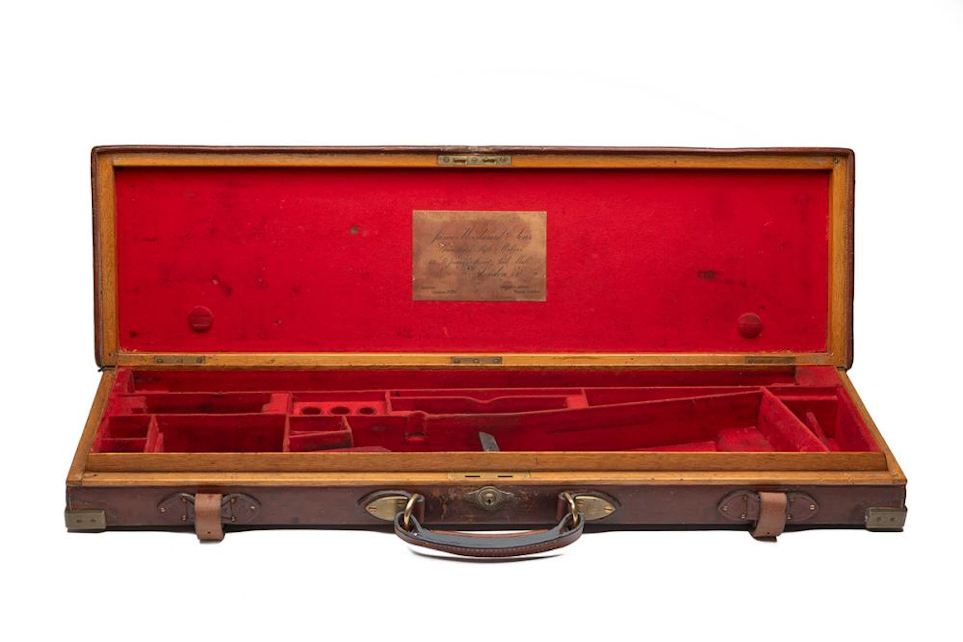 JAMES WOODWARD & SON A BRASS-CORNERED OAK AND LEATHER SINGLE GUNCASE,
