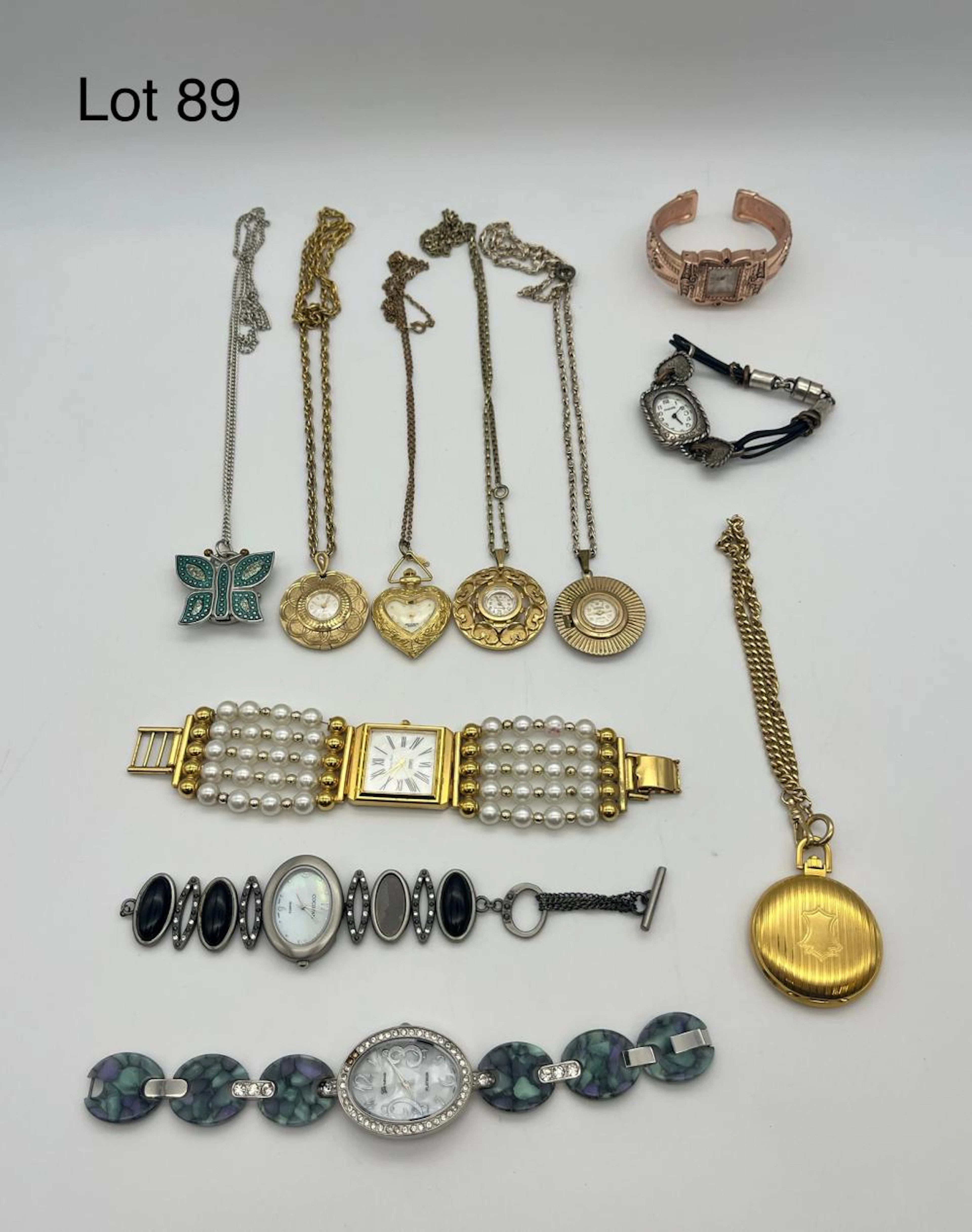 Collection of Timepieces Featuring Pendant Watches