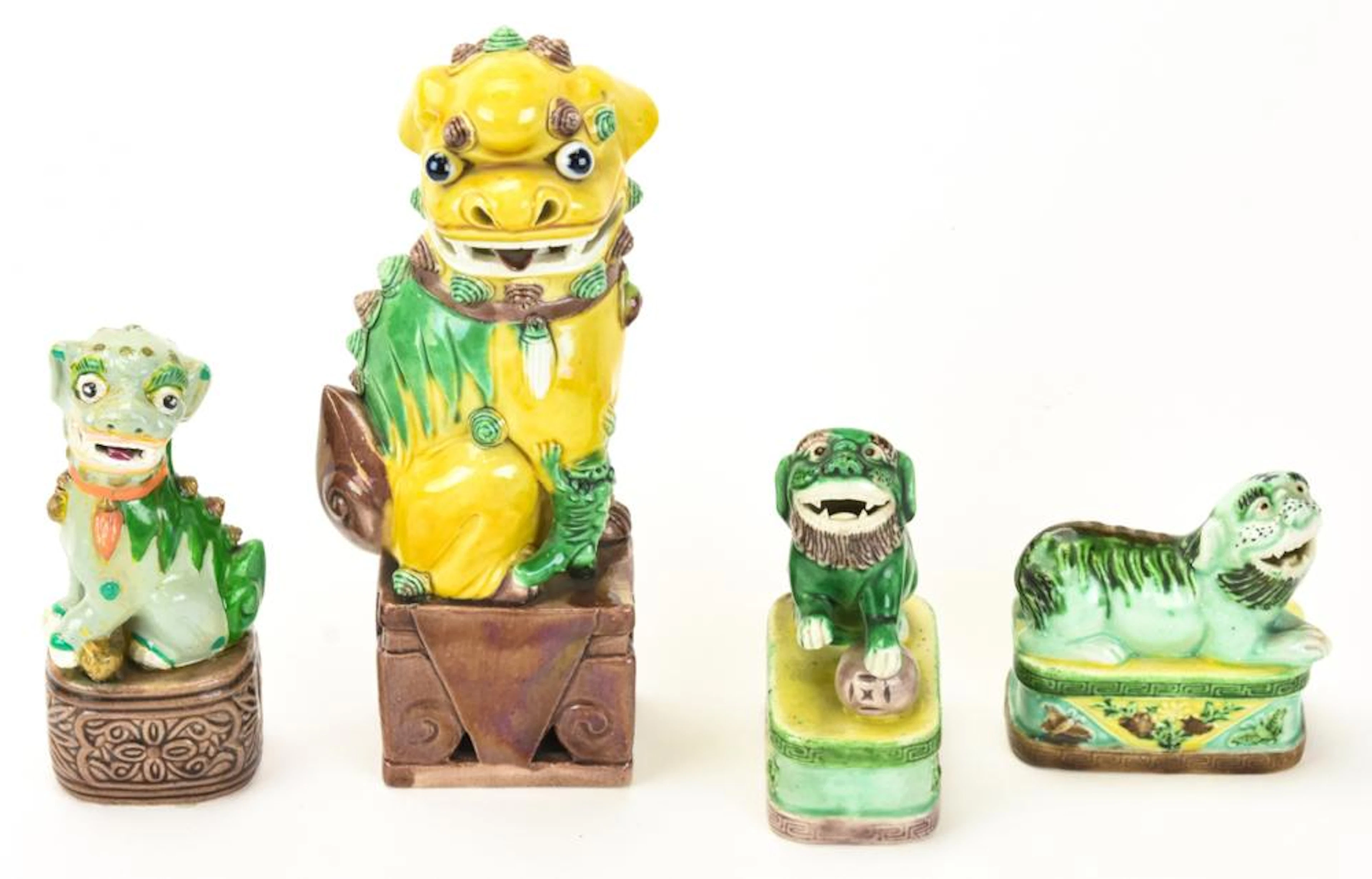 Four Chinese Porcelain Foo Dog Statues
