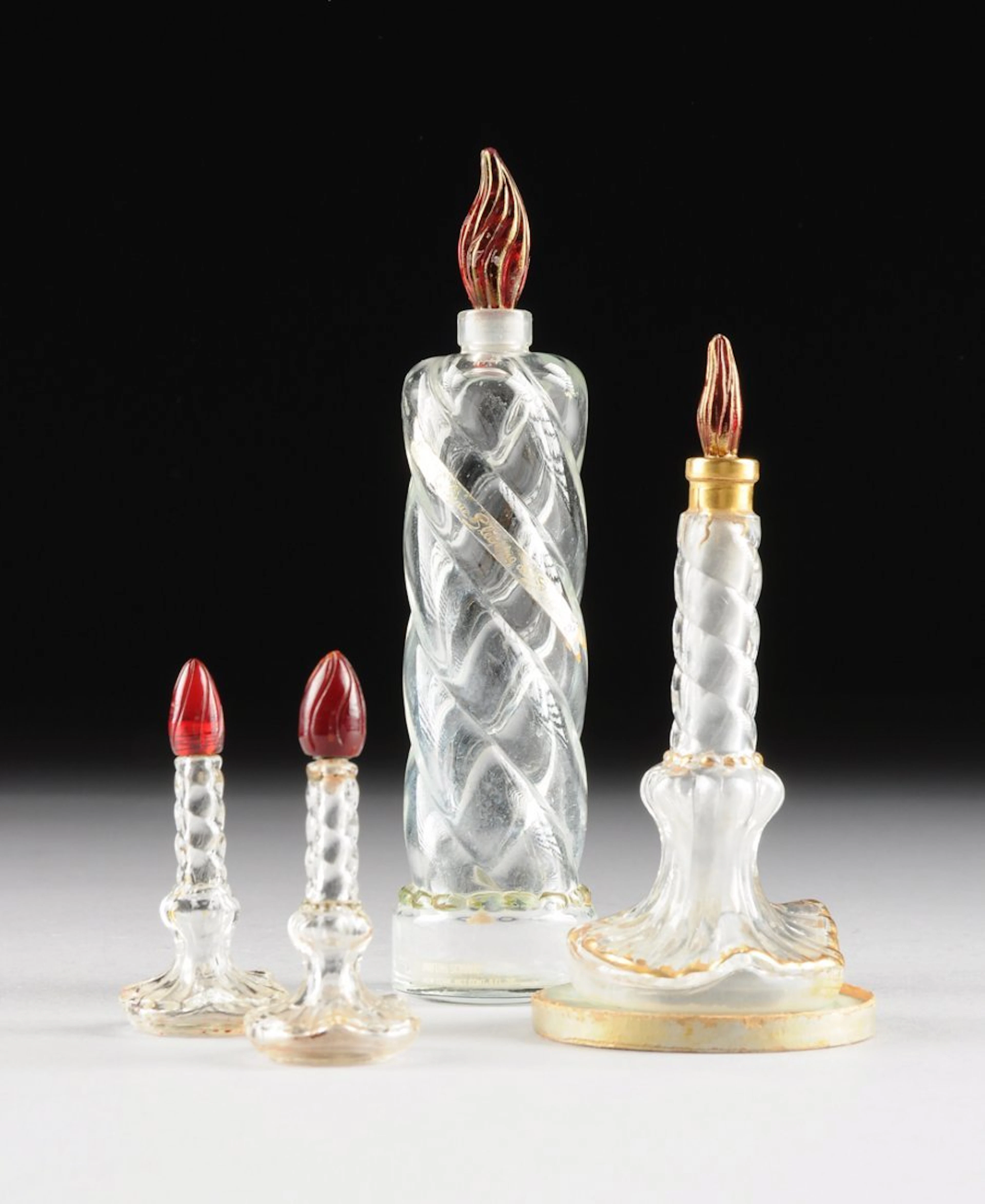 A group of "sleeping" glass figural perfume bottles for