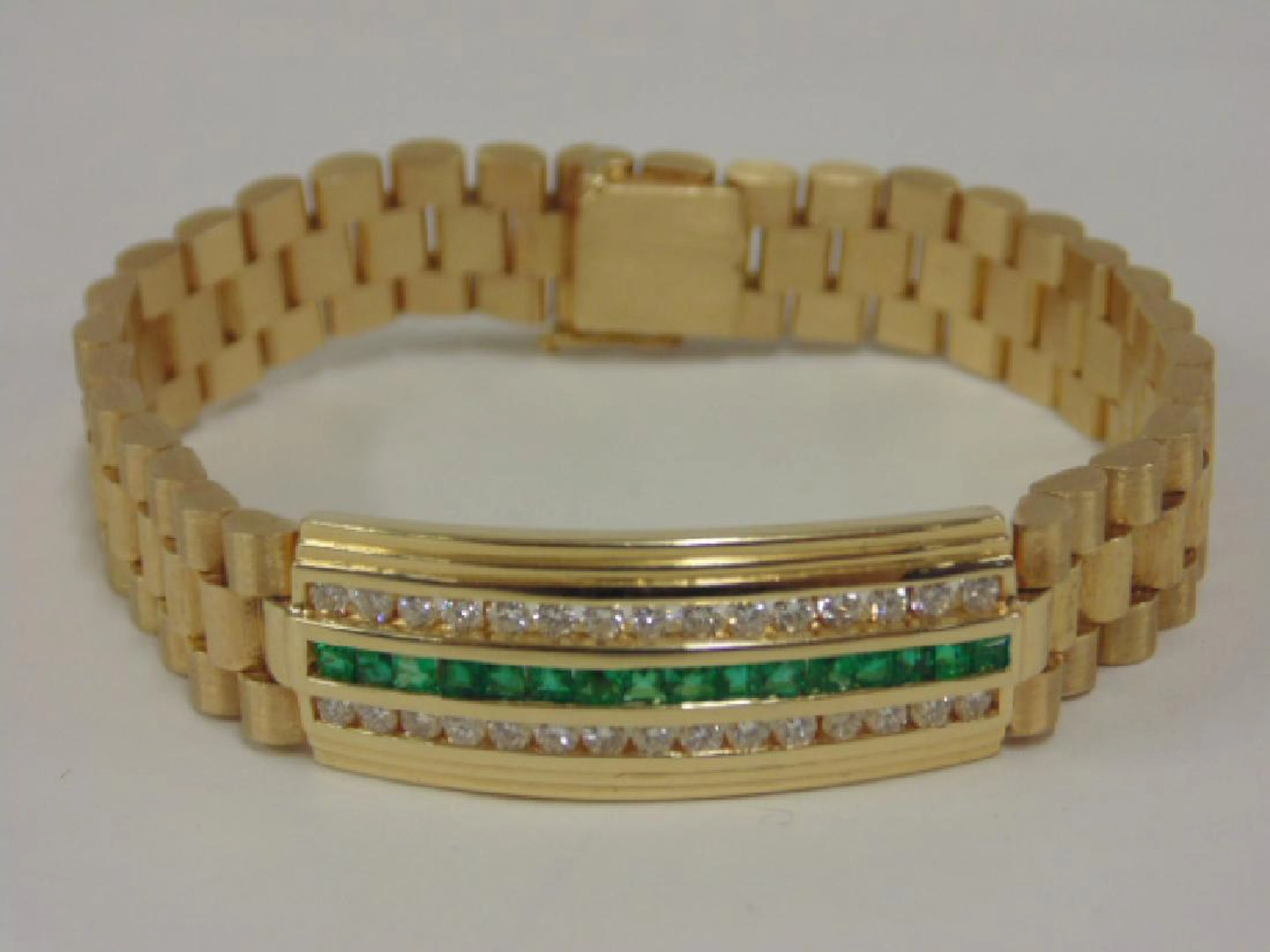 Yellow gold Rolex style bracelet, emeralds & diamonds
