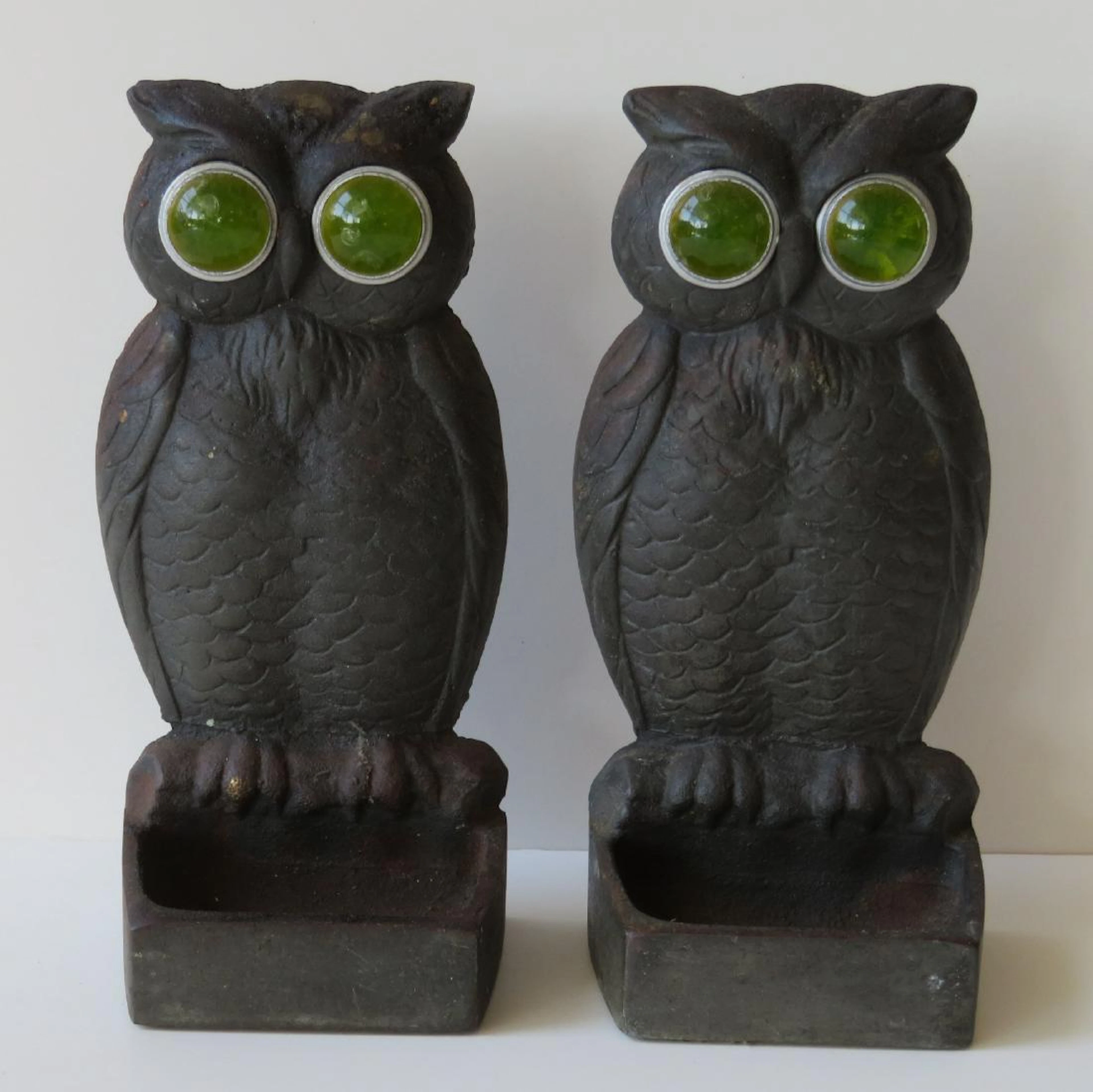 An unusual pair of cast iron owl match safes with large
