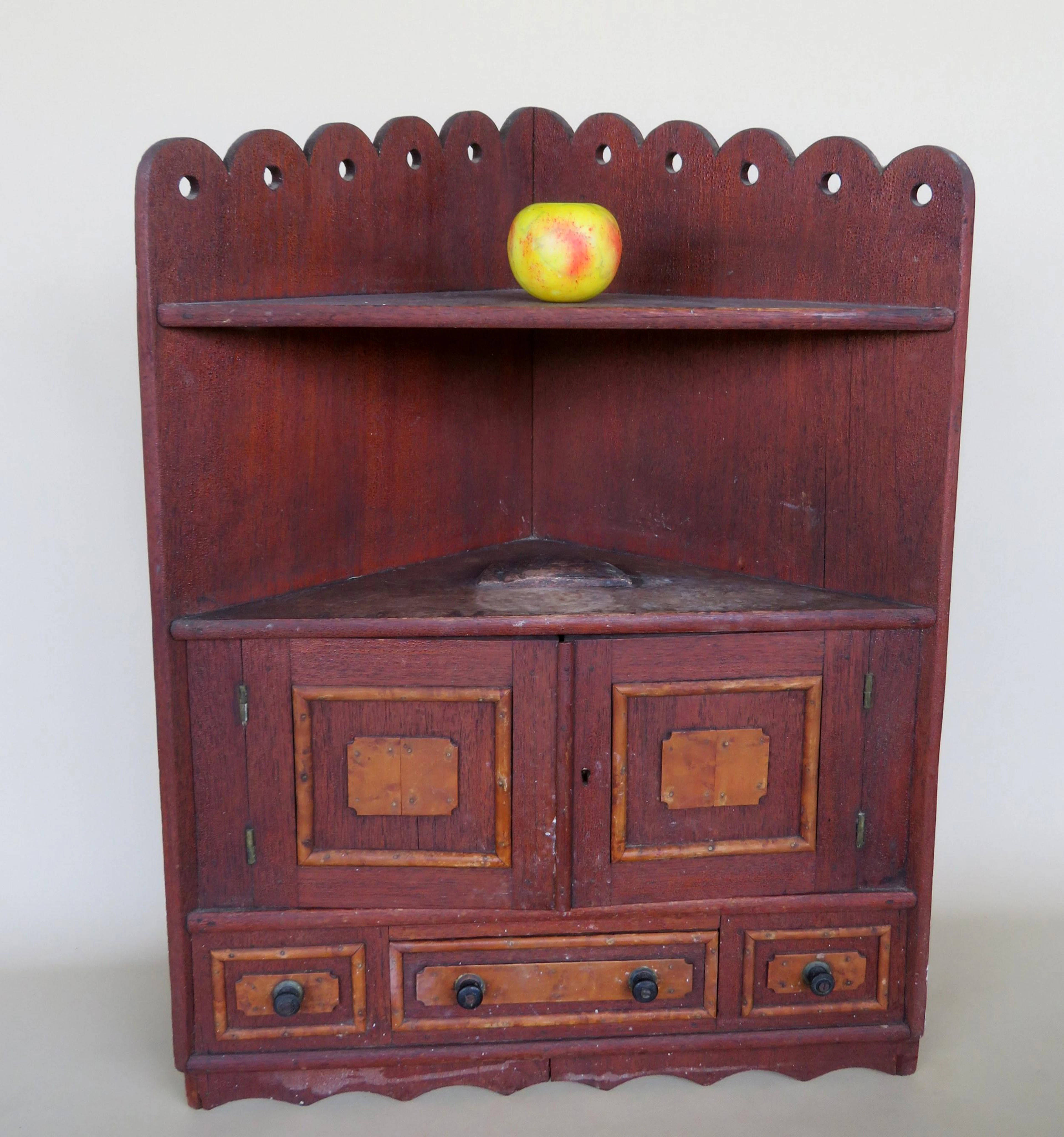 Folk art and rustic hanging corner cupboard in