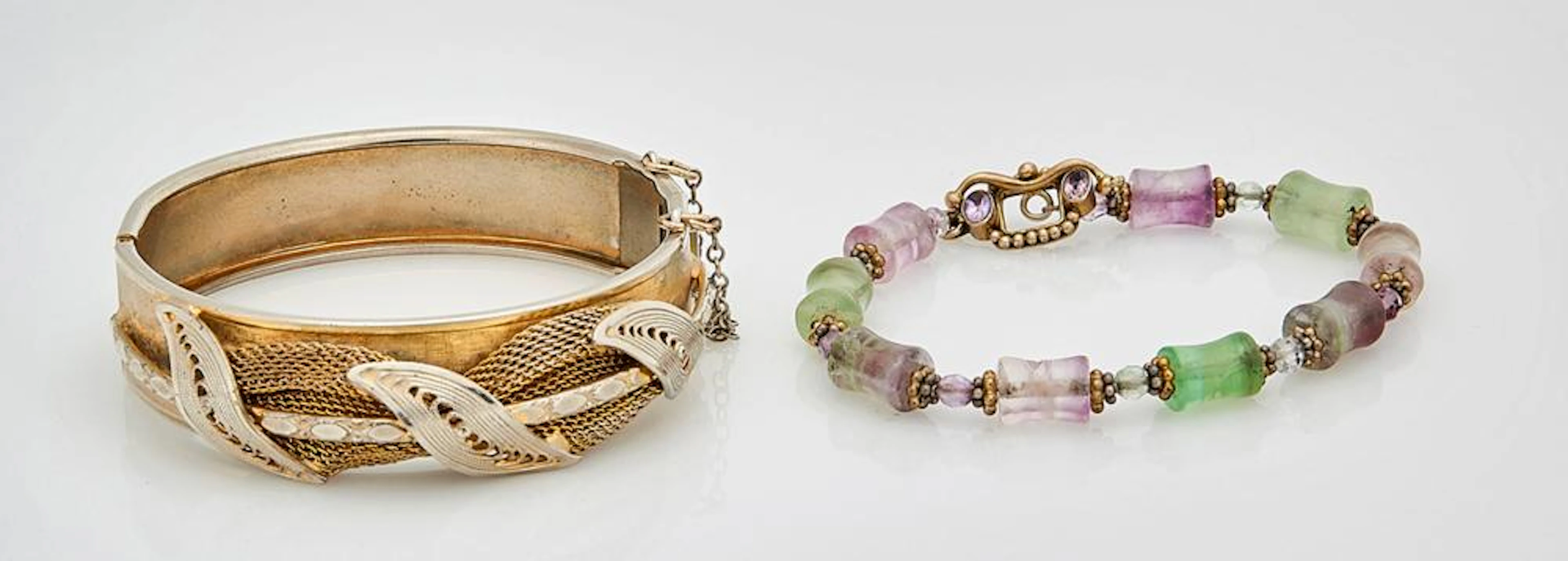 TWO SILVER AND METAL BRACELETS