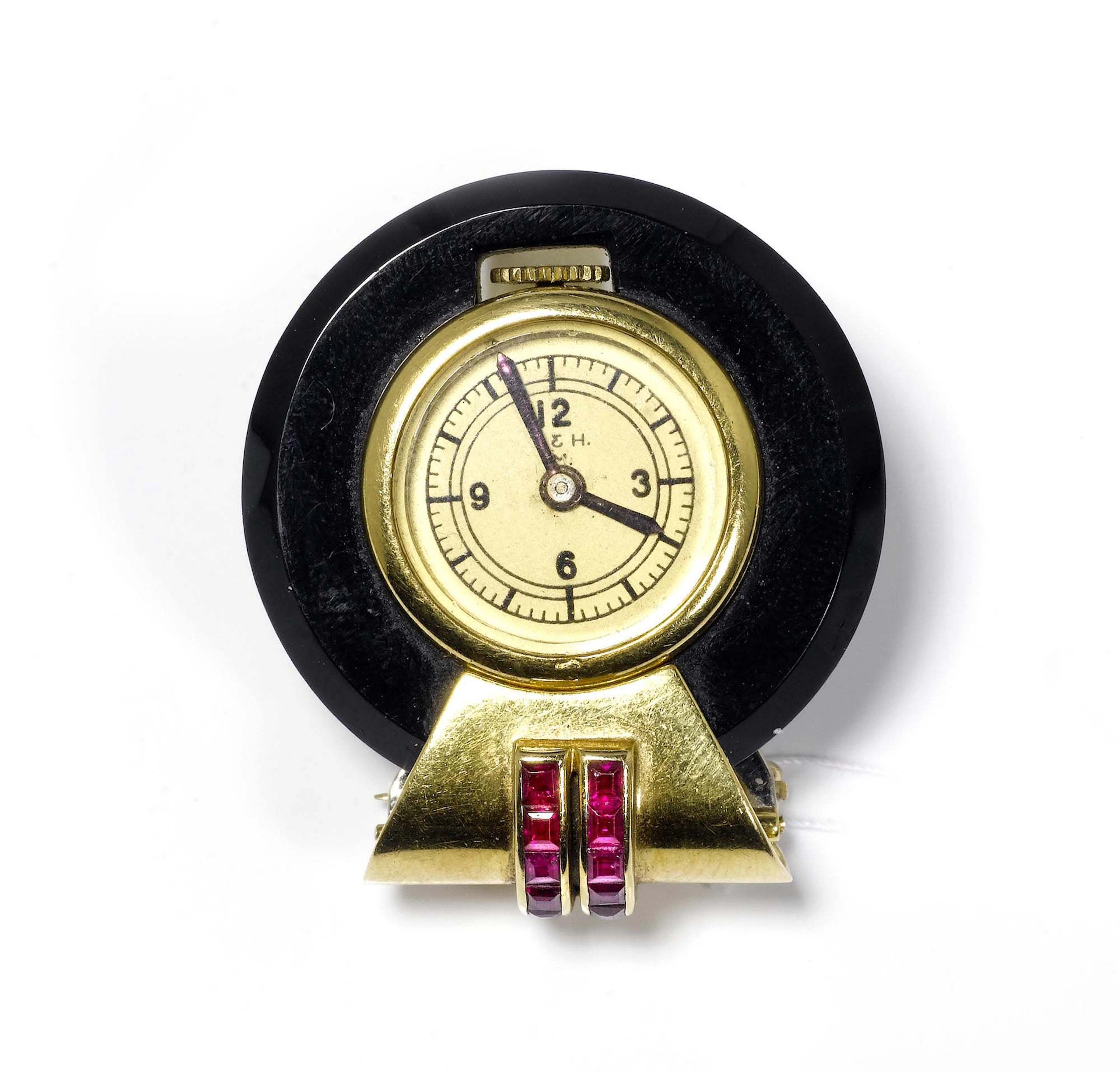 GOLD-RUBIN-ONYX-CLIPUHR, T. & H. M., 30er-Jahre.