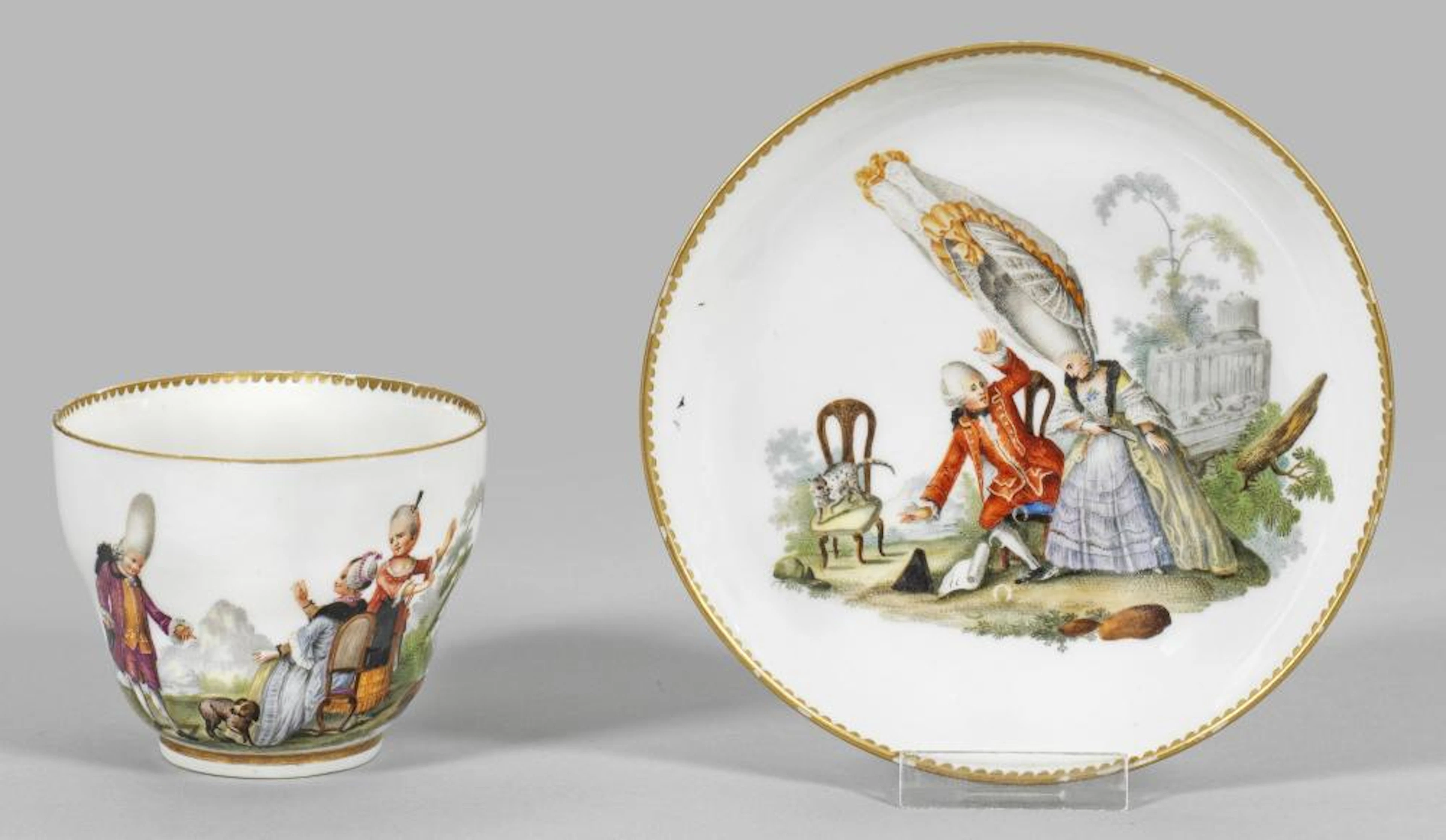Ziertasse mit humoristischen Figurenszene