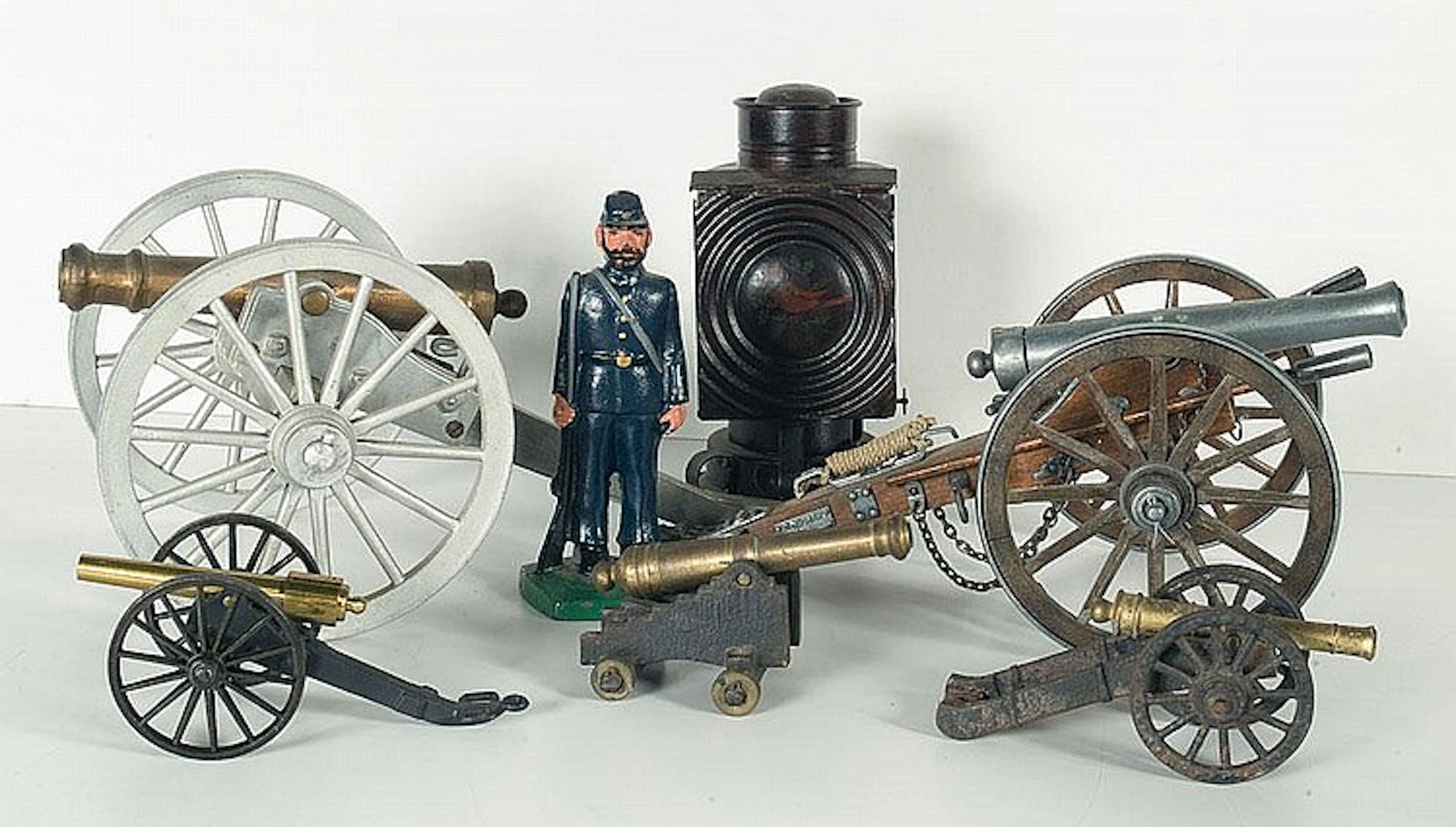 Five Toy Cannons, Statuette and Lantern